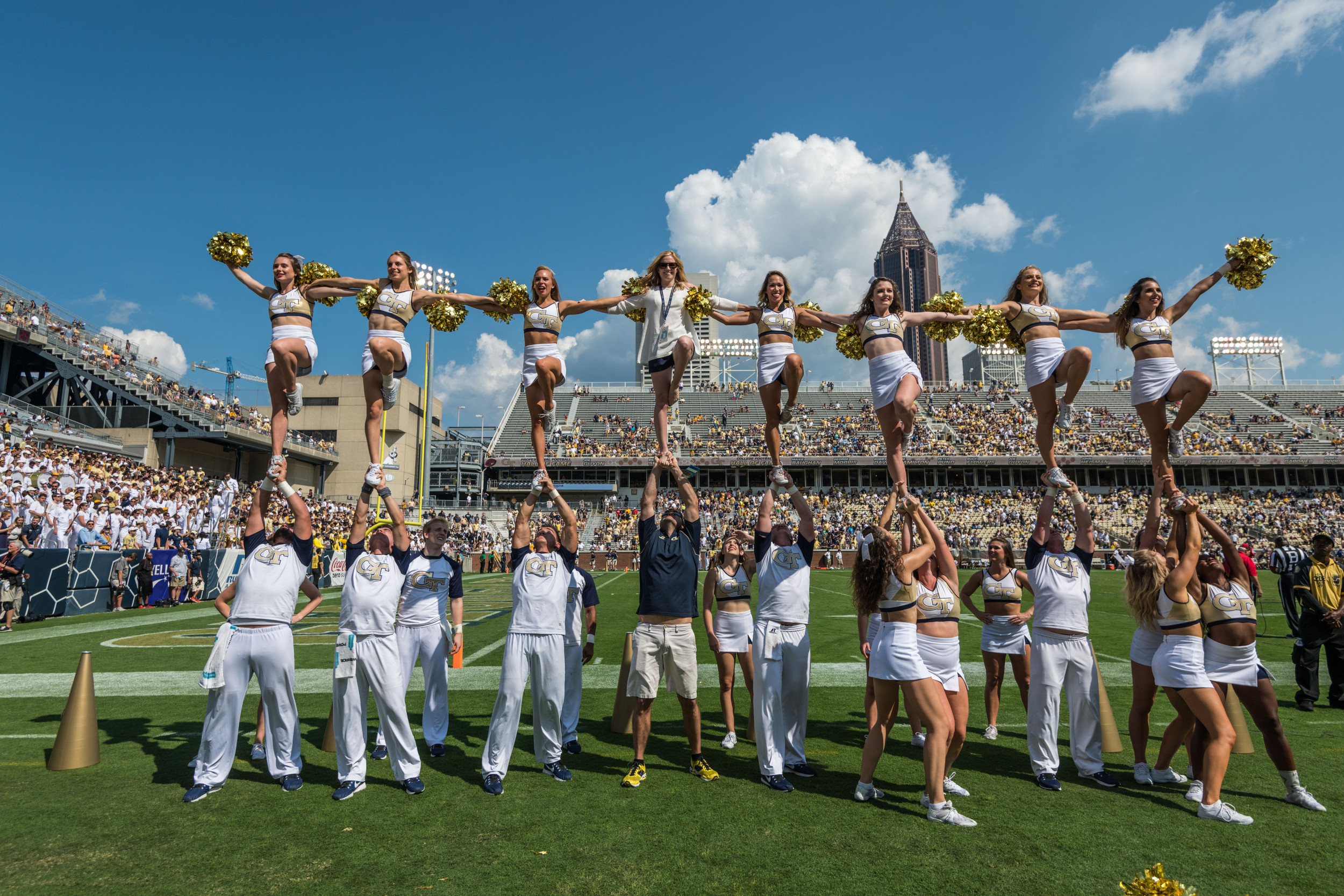 The GT Cheerleaders perform a stunt