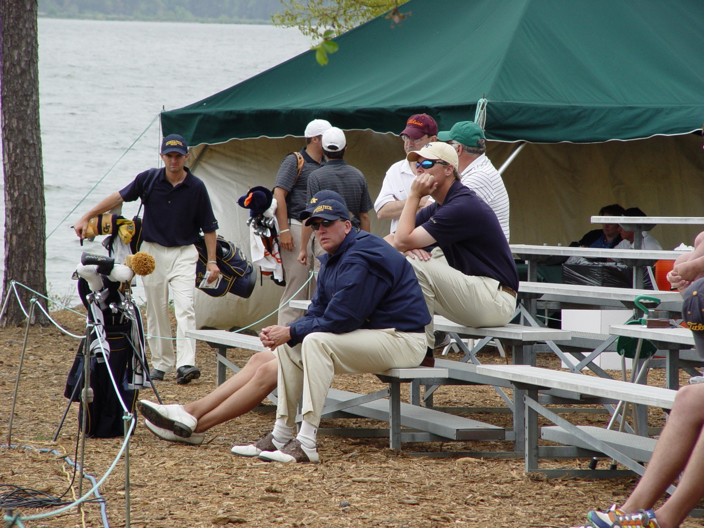 Head coach Bruce Heppler (nearest) watches his players approach the 18th green during round two of the ACC Golf Championship, April 19, 2008.