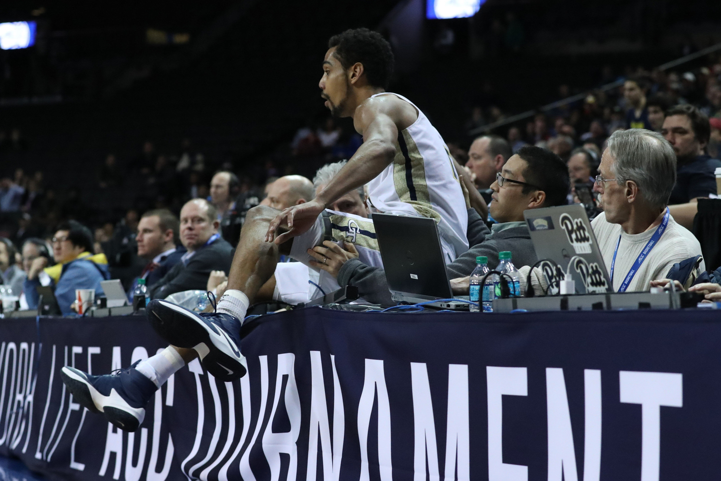 Forward Quinton Stephens lands on the table saving an outbound ball during the second half against the Pittsburgh Panthers during the ACC Conference Tournament at Barclays Center. Credit: Anthony Gruppuso-USA TODAY Sports