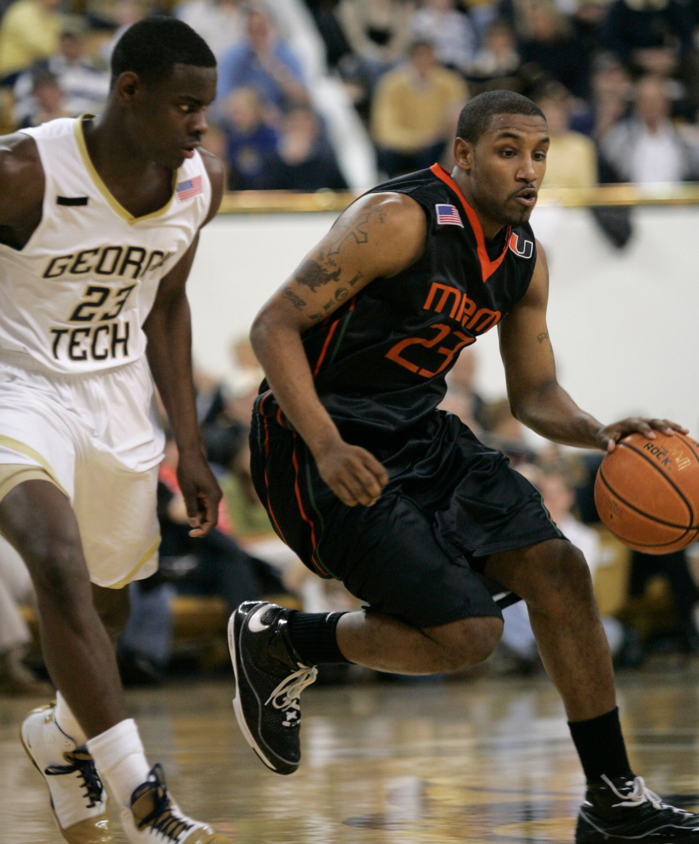 Miami guard James Dews drives on Georgia Tech guard Anthony Morrow, left, during the second half of a basketball game Sunday, Feb. 17, 2008, in Atlanta. Miami won 64-63. (AP Photo/John Amis)