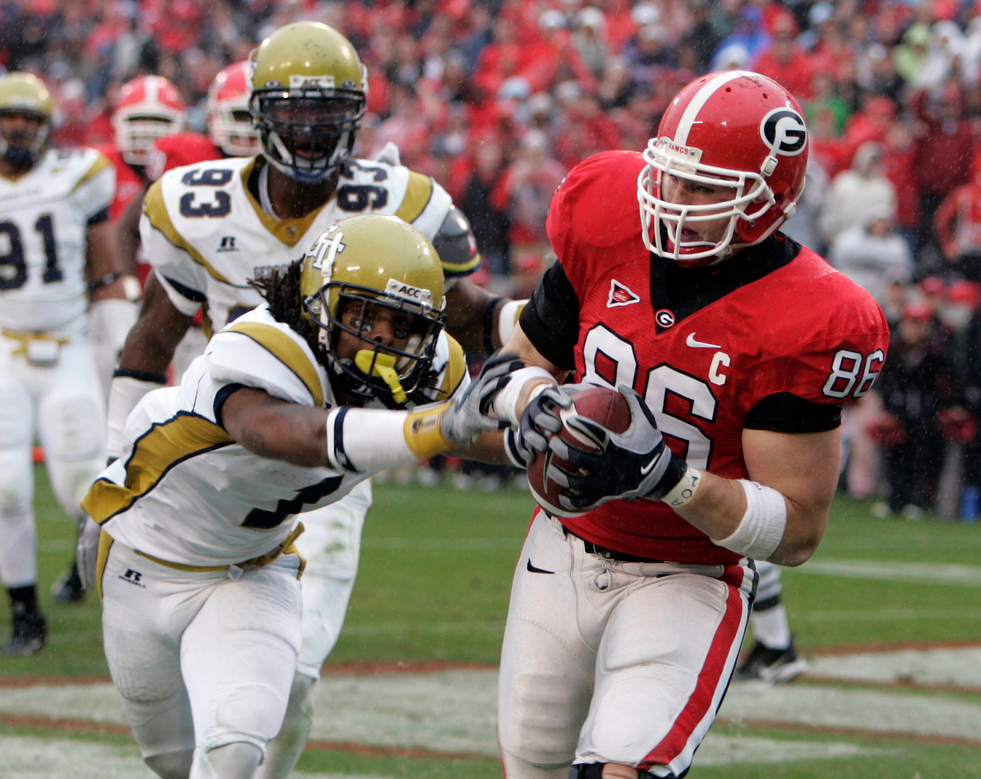 Georgia tight end Tripp Chandler makes a catch for a touchdown as Morgan Bunett defends in the first quarter in Athens, Ga., Saturday Nov. 29, 2008. (AP Photo/John Bazemore)