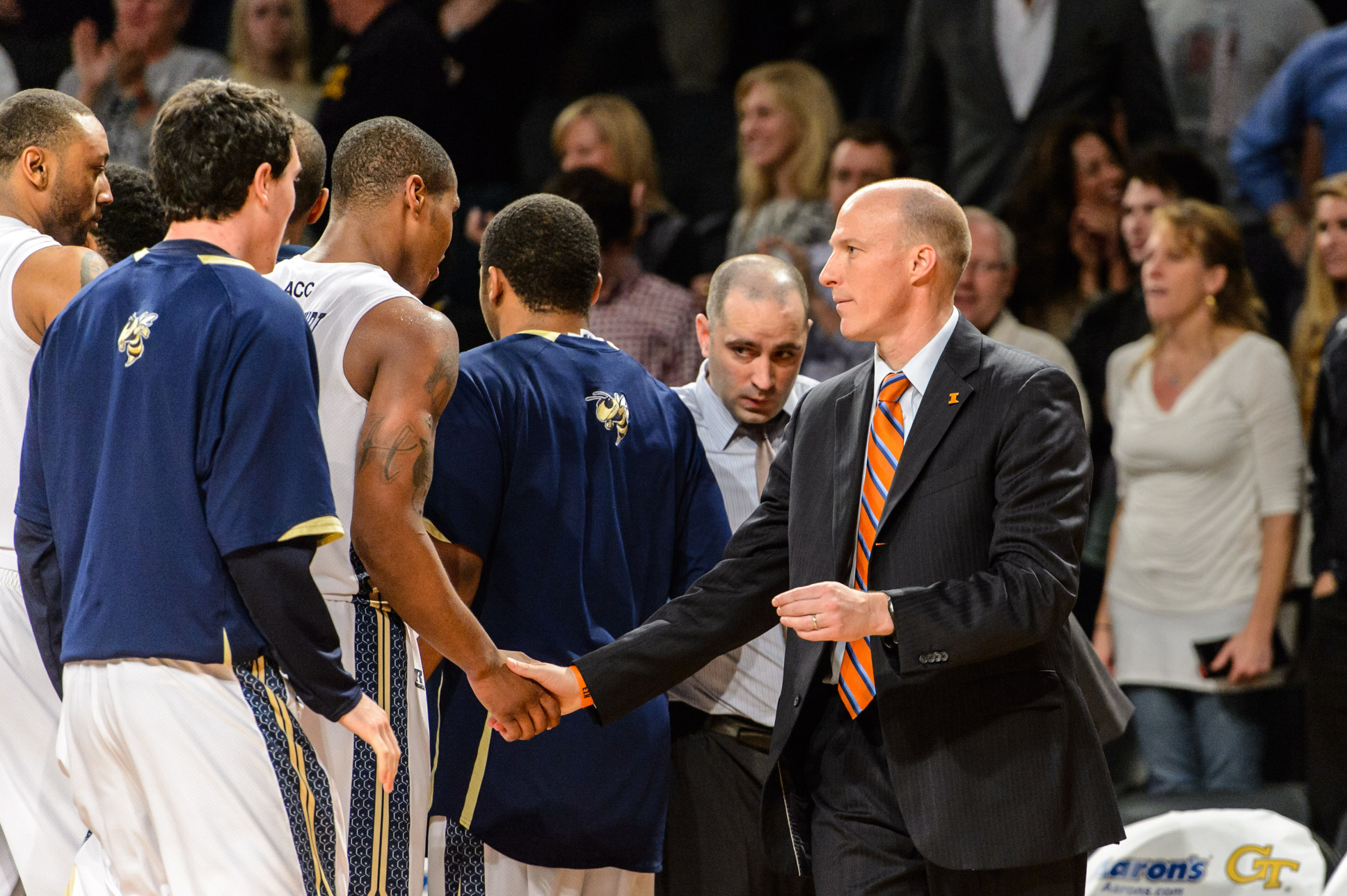 Illinois Basketball Head Coach John Groce shakes hands with Georgia Tech players after the game.