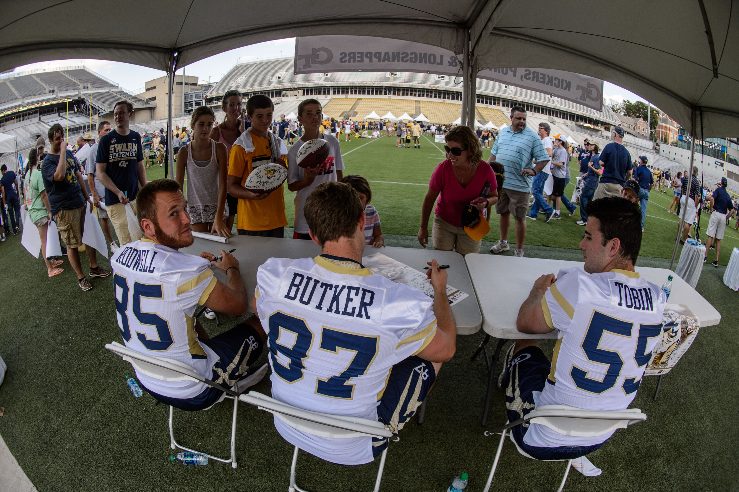 The specialists sign autographs for fans