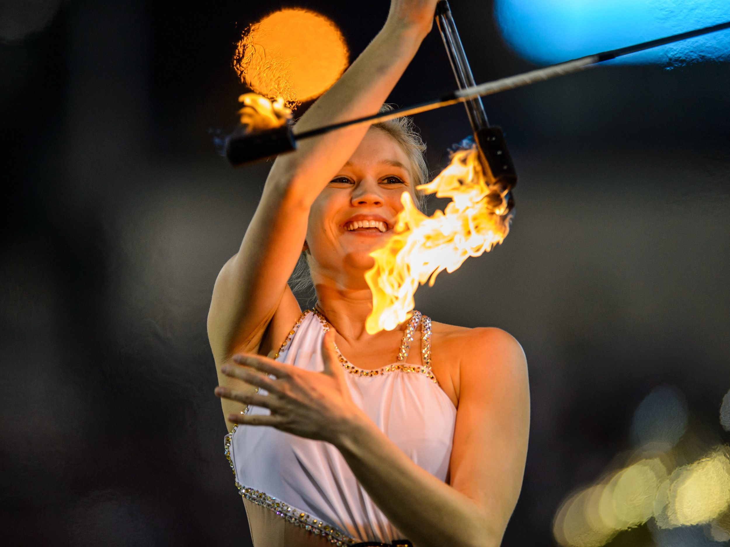 The Georgia Tech Golden Girl twirls fire during halftime