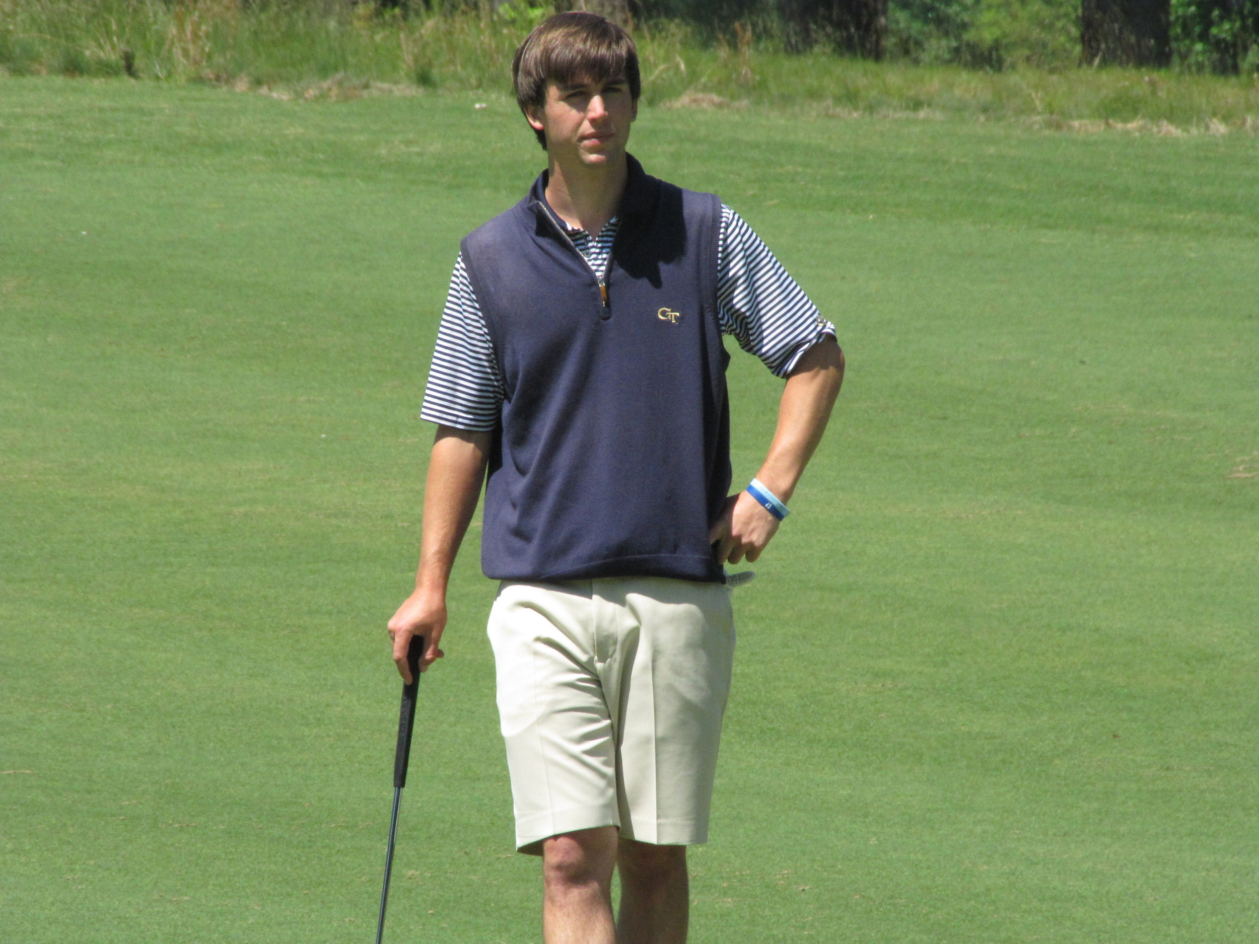 Ollie Schniederjans watches his partners putt out at the 7th green during the final round of the NCAA Raleigh Regional.