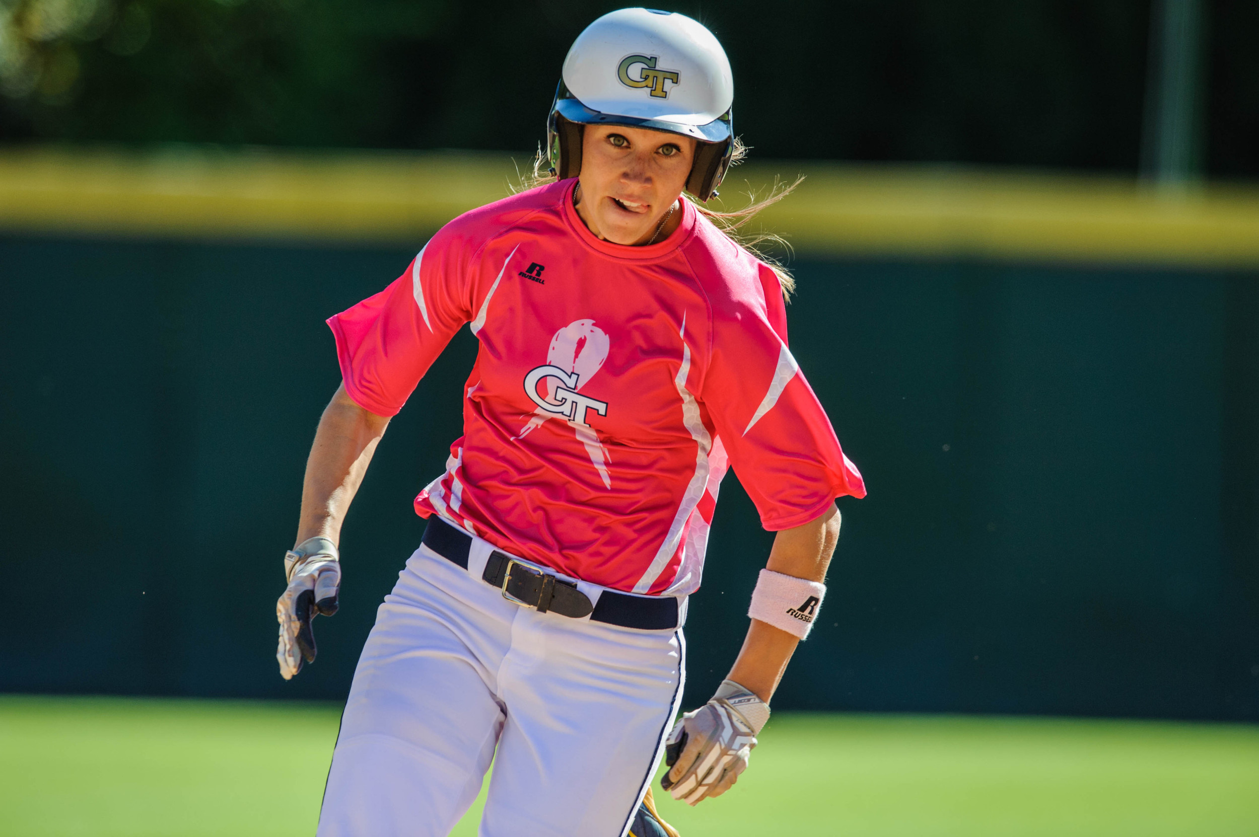A Georgia Tech player runs around 3rd base.