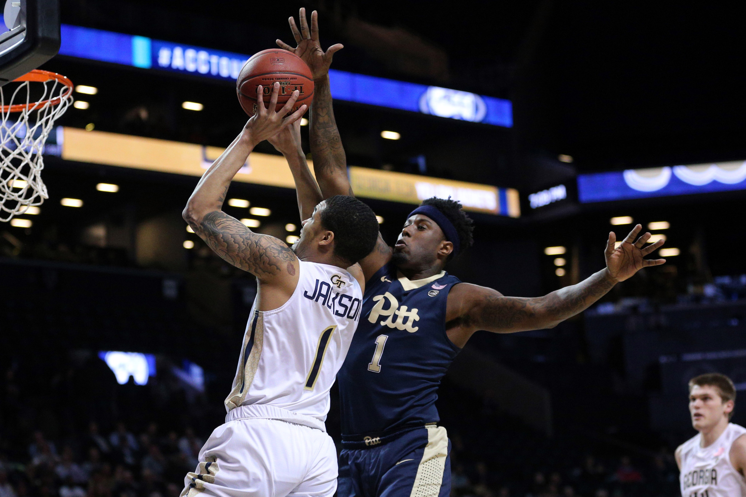 Guard Tadric Jackson shoots against Pittsburgh Panthers forward Jamel Artis during the first half of an ACC Conference Tournament game at Barclays Center. Credit: Brad Penner-USA TODAY Sports