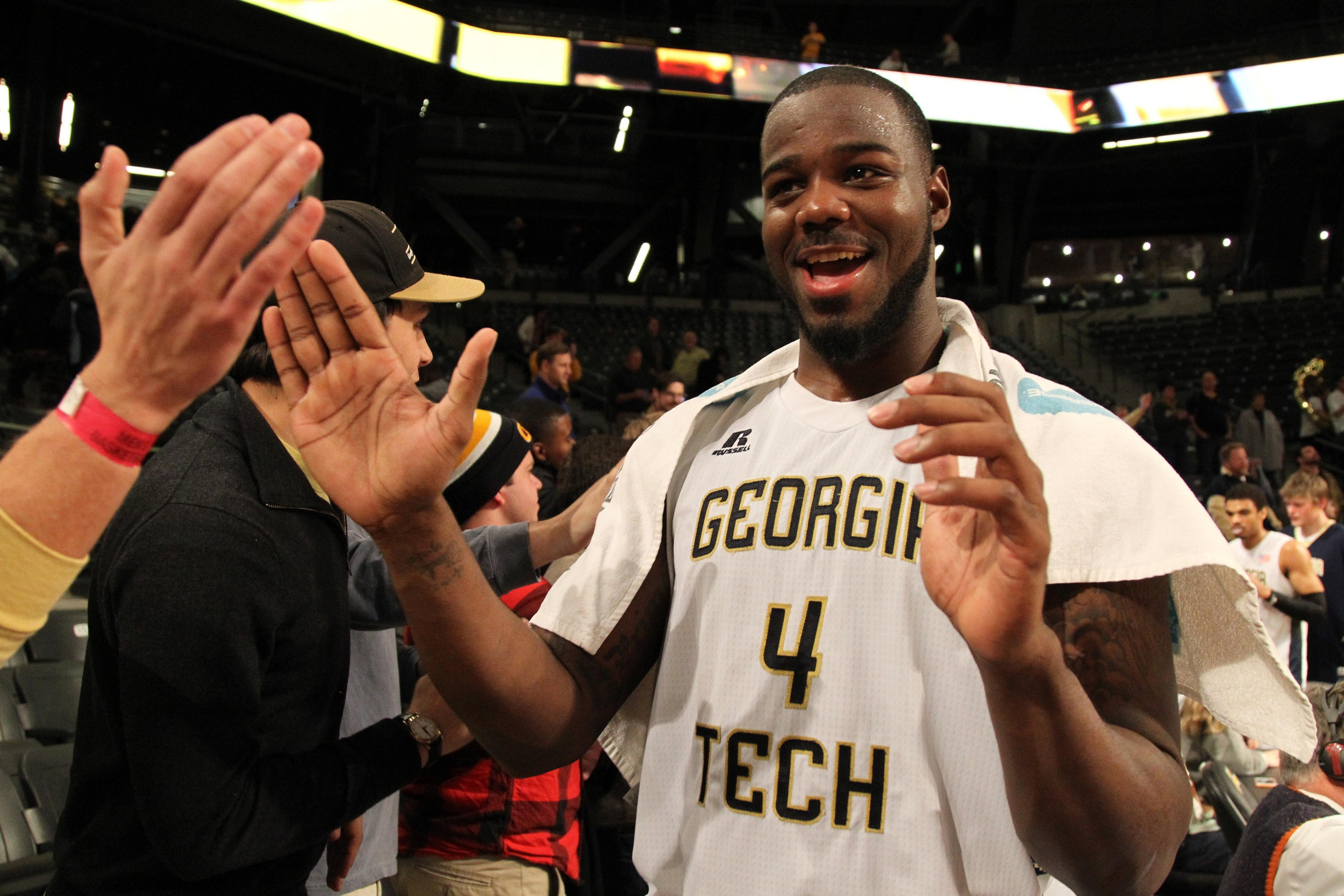 Georgia Tech Yellow Jackets center Demarco Cox (4) celebrates a victory with fans against the Clemson Tigers in the second half at McCamish Pavilion. Georgia Tech defeated Clemson 63-52. Mandatory Credit: Brett Davis-USA TODAY Sports