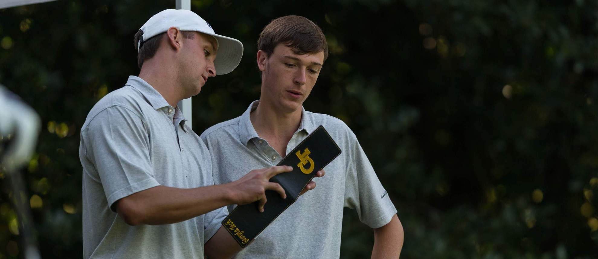 10004901.jpeg Assistant coach Drew McGee and Luke Schniederjans during the second round of the Golf Club of Georgia Collegiate, October 21, 2017