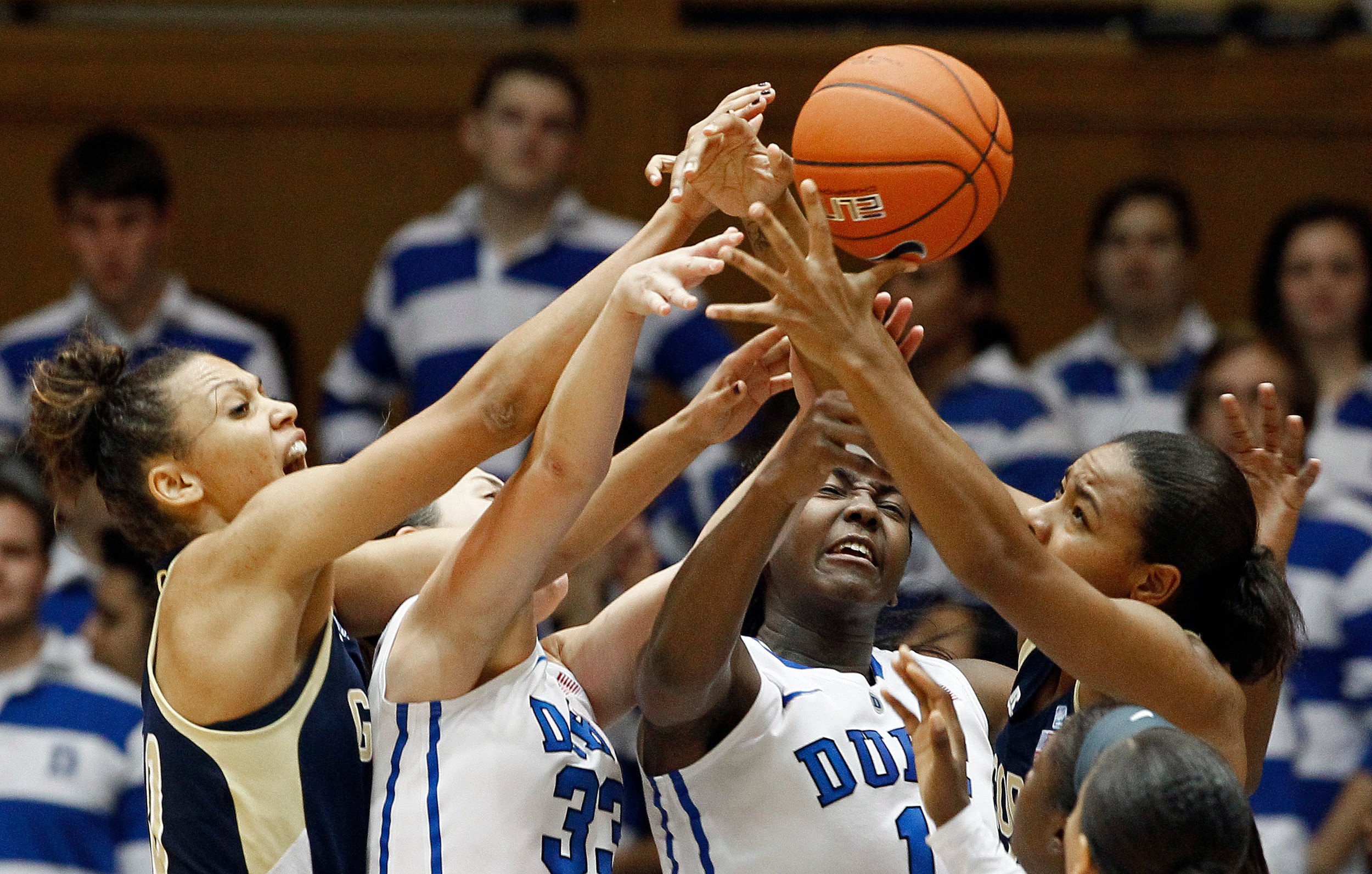 Georgia Tech's Jasmine Blain, right, and Danielle Hamilton-Carter struggle with Duke's Haley Peters (33) and Elizabeth Williams (1) during the second half of an NCAA women's college basketball game in Durham, N.C., Thursday, Dec. 6, 2012. Duke won 85-52. (AP Photo/Gerry Broome)