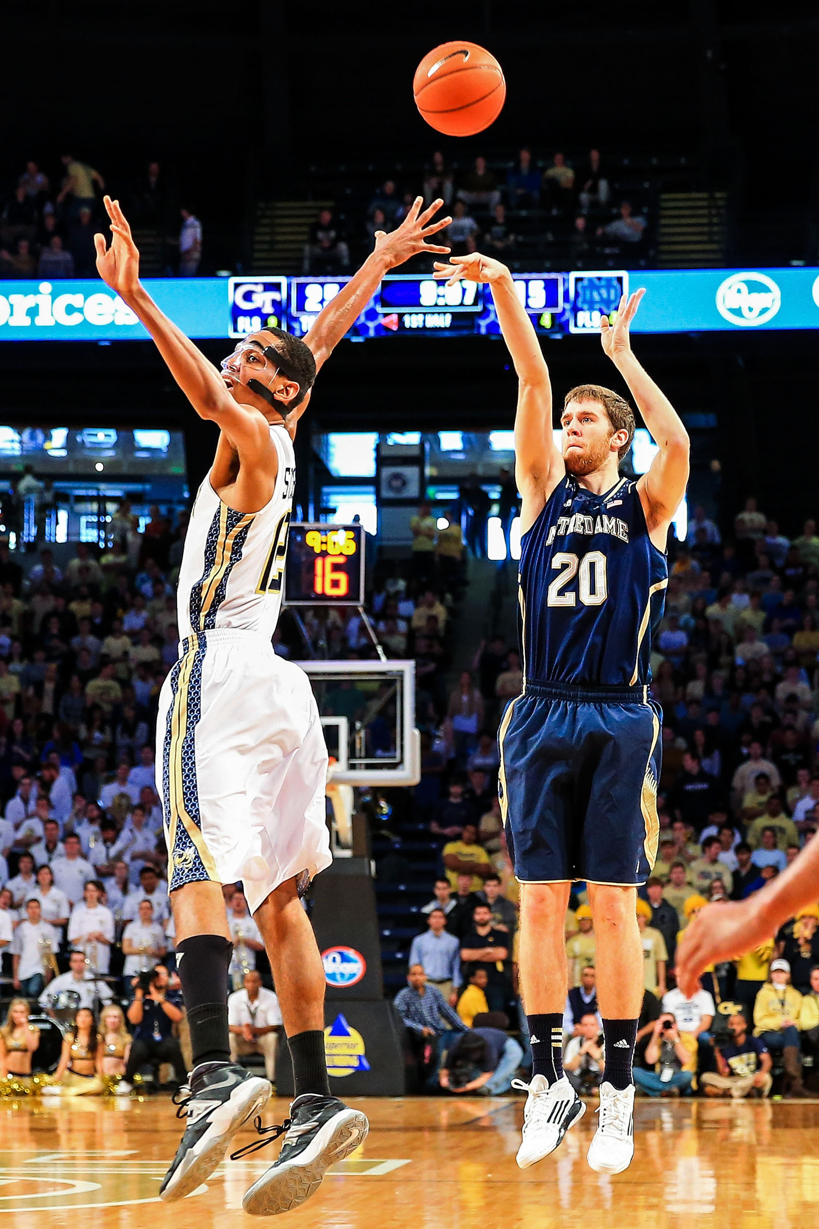 Jan 11, 2014; Atlanta, GA, USA; Notre Dame Fighting Irish forward Austin Burgett (20) shoots over Georgia Tech Yellow Jackets forward Quinton Stephens (12) in the first half at Hank McCamish Pavilion. Mandatory Credit: Daniel Shirey-USA TODAY Sports