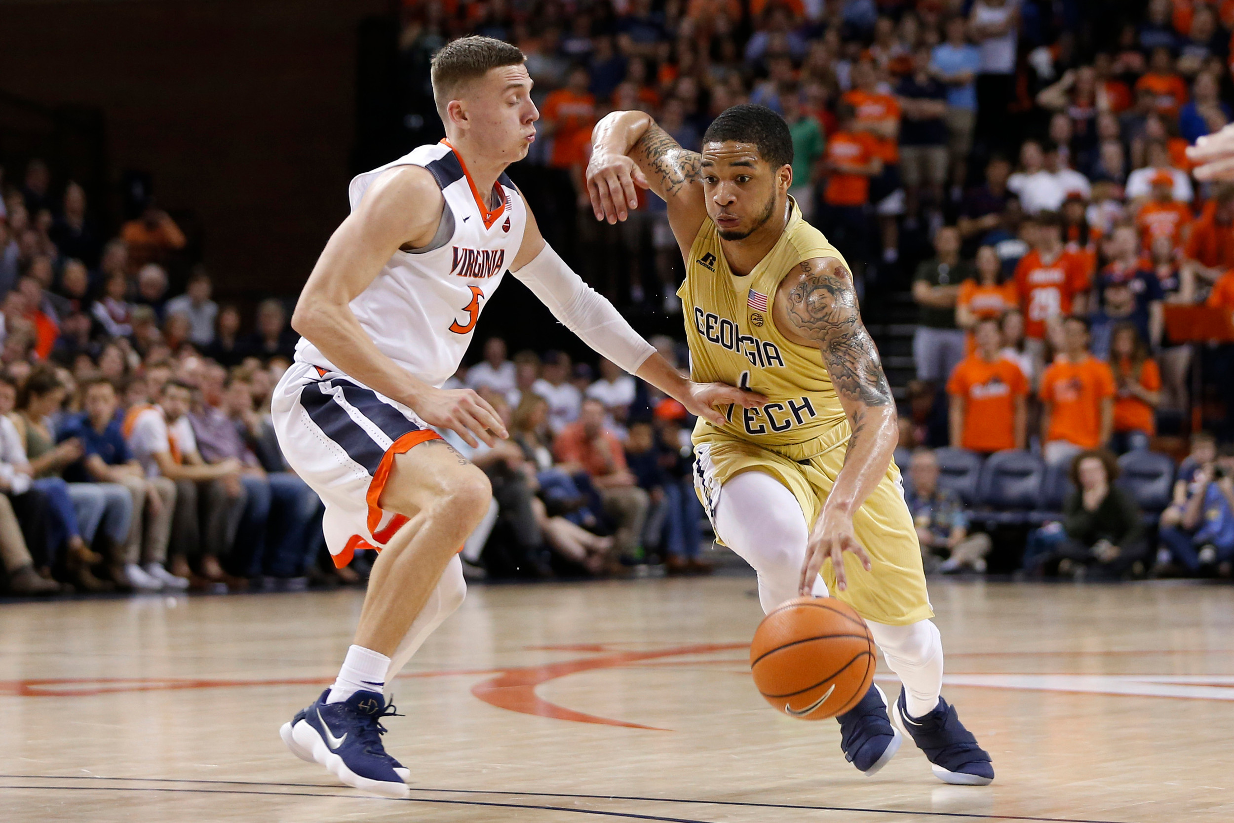 Feb 21, 2018; Charlottesville, VA, USA; Georgia Tech Yellow Jackets guard Tadric Jackson (1) dribbles the ball as Virginia Cavaliers guard Kyle Guy (5) defends during the first half at John Paul Jones Arena. Mandatory Credit: Amber Searls-USA TODAY Sports