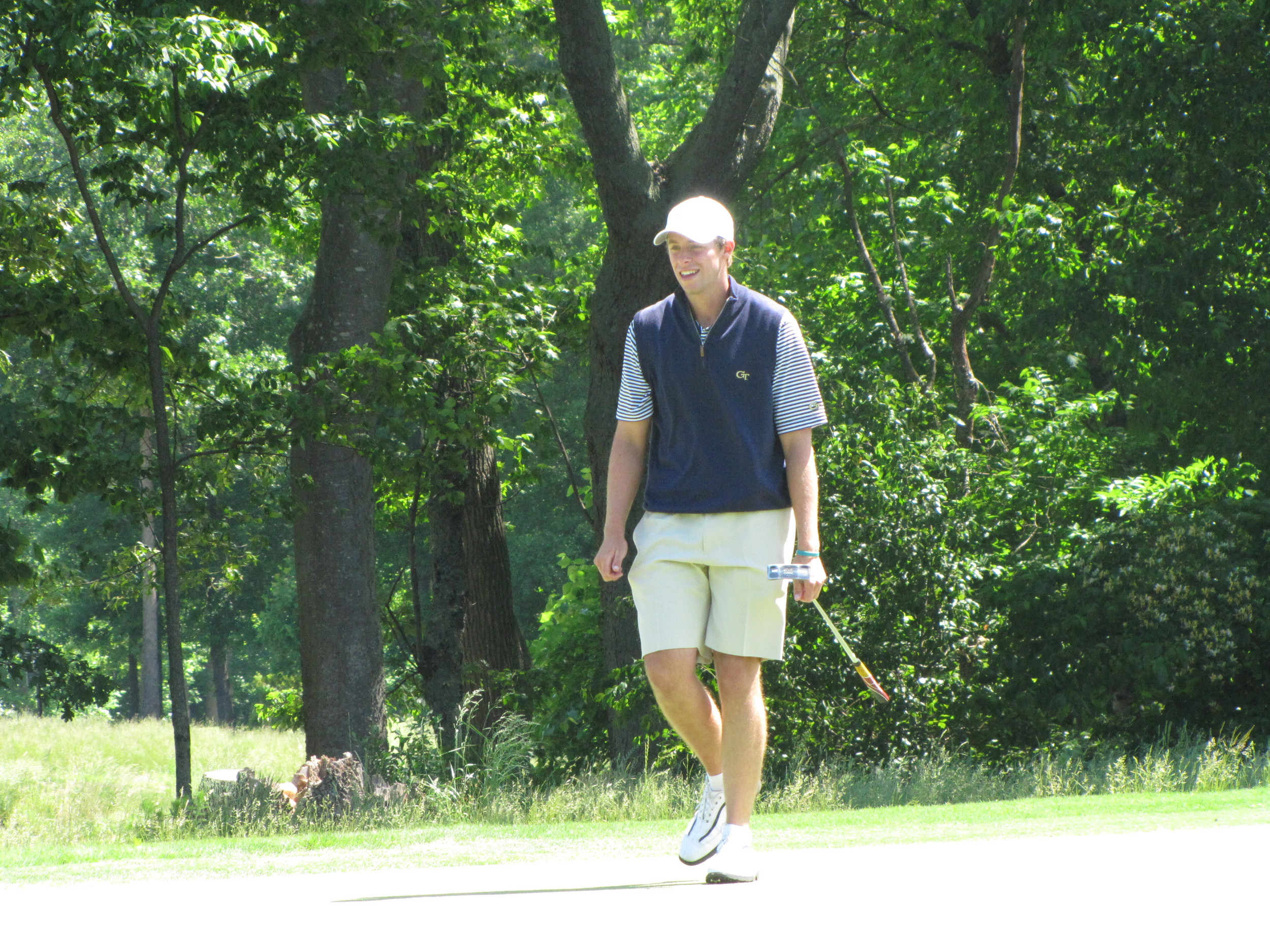 Bo Andrews follows his long birdie attempt at the 6th green during the final round of the NCAA Raleigh Regional.