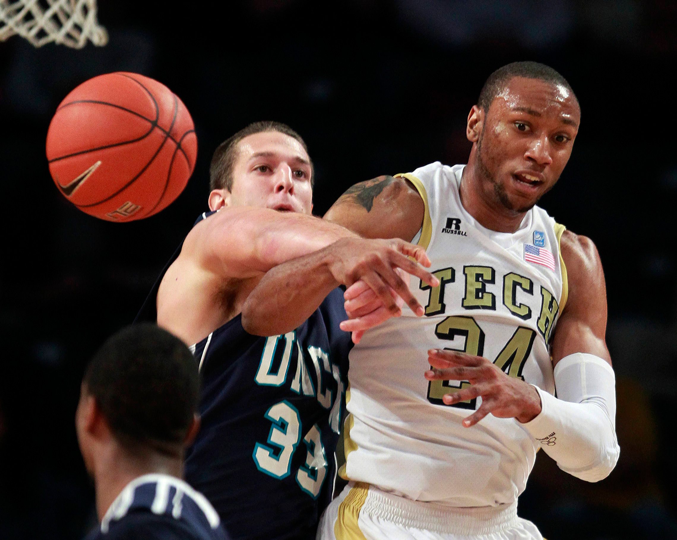 North Carolina-Wilmington forward Shane Reybold (33) knocks the ball away from Georgia Tech forward Kammeon Holsey (24) in the second half. (AP Photo/John Bazemore)