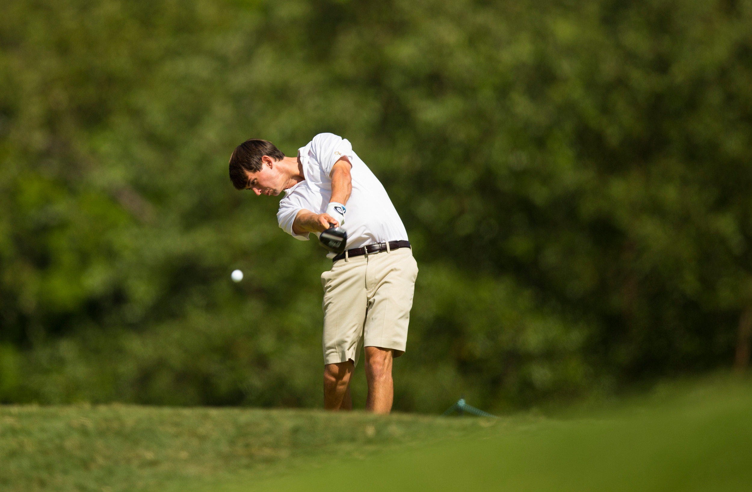 Ollie Schniederjans plays his tee shot on the 14th hole during the third round of match play at the 2014 U.S. Amateur at Atlanta Athletic Club in Johns Creek, Ga. on Thursday, Aug. 14, 2014. (Copyright USGA/John Mummert)