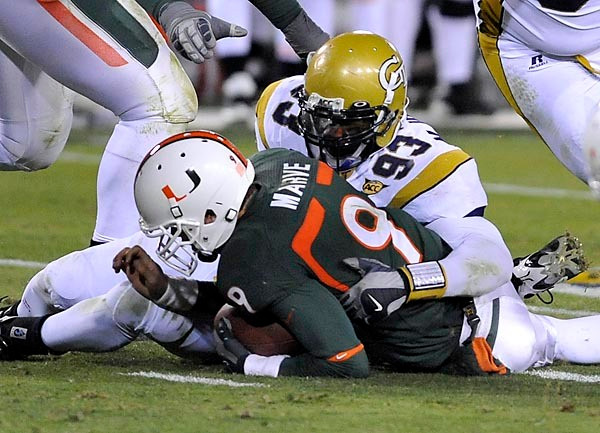 Michael Johnson (93) and the Georgia Tech defense were successful in pressuring the Miami offense all night. (Photo by LensEffects)