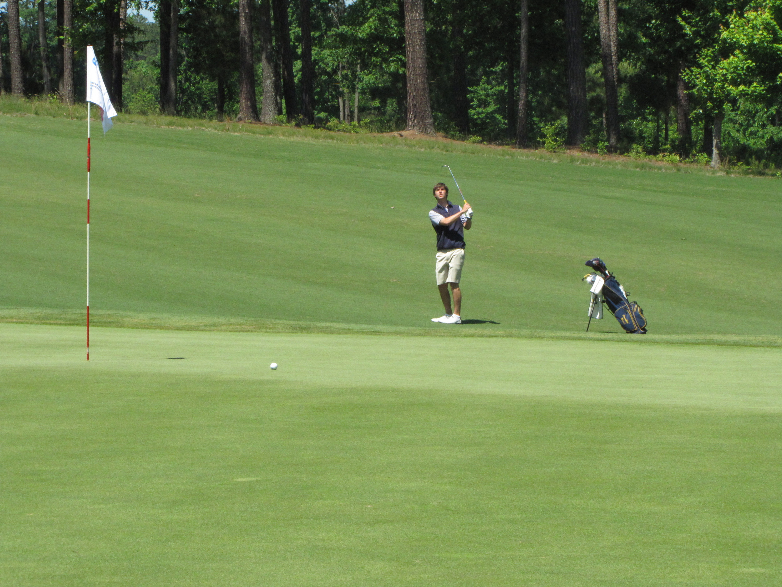 Ollie Schniederjans plays his 3rd shot ar the par-5 7th hole during the final round of the NCAA Raleigh Regional.