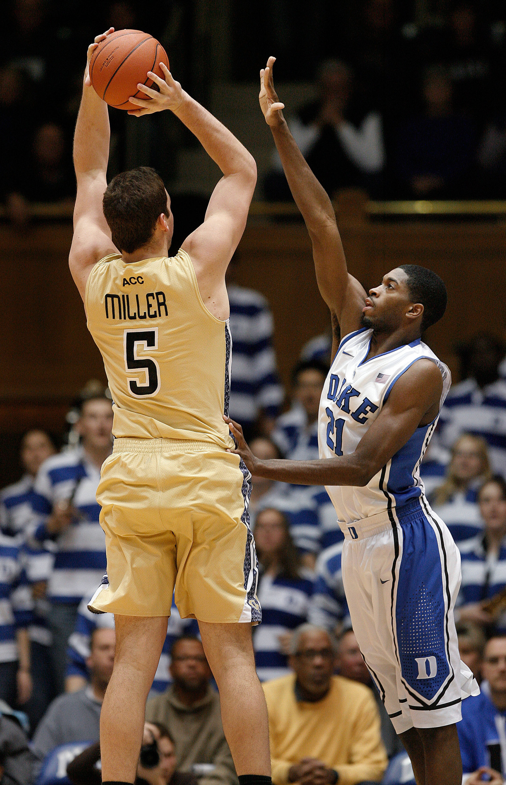 Jan 7, 2014; Durham, NC, USA; Georgia Tech Yellow Jackets center Daniel Miller (5) shoots against Duke Blue Devils forward Amile Jefferson (21) at Cameron Indoor Stadium. Mandatory Credit: Mark Dolejs-USA TODAY Sports
