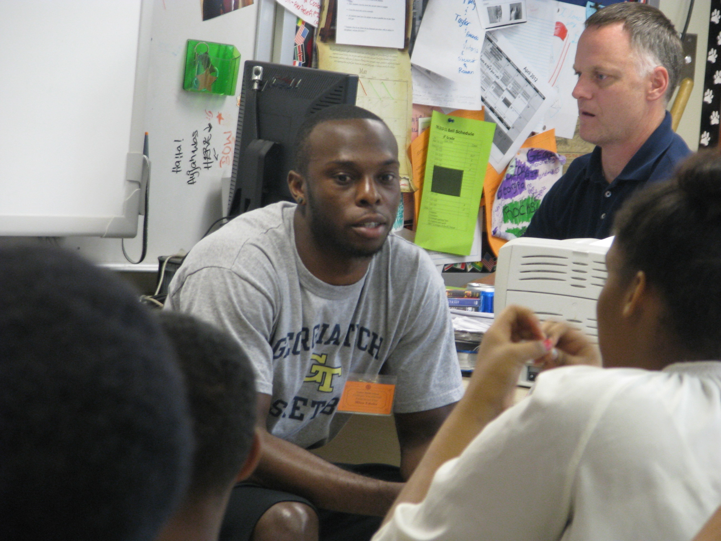 Mfon Udofia joins other college students from the area to speak to Tucker Middle School students about college life and preparing for college.