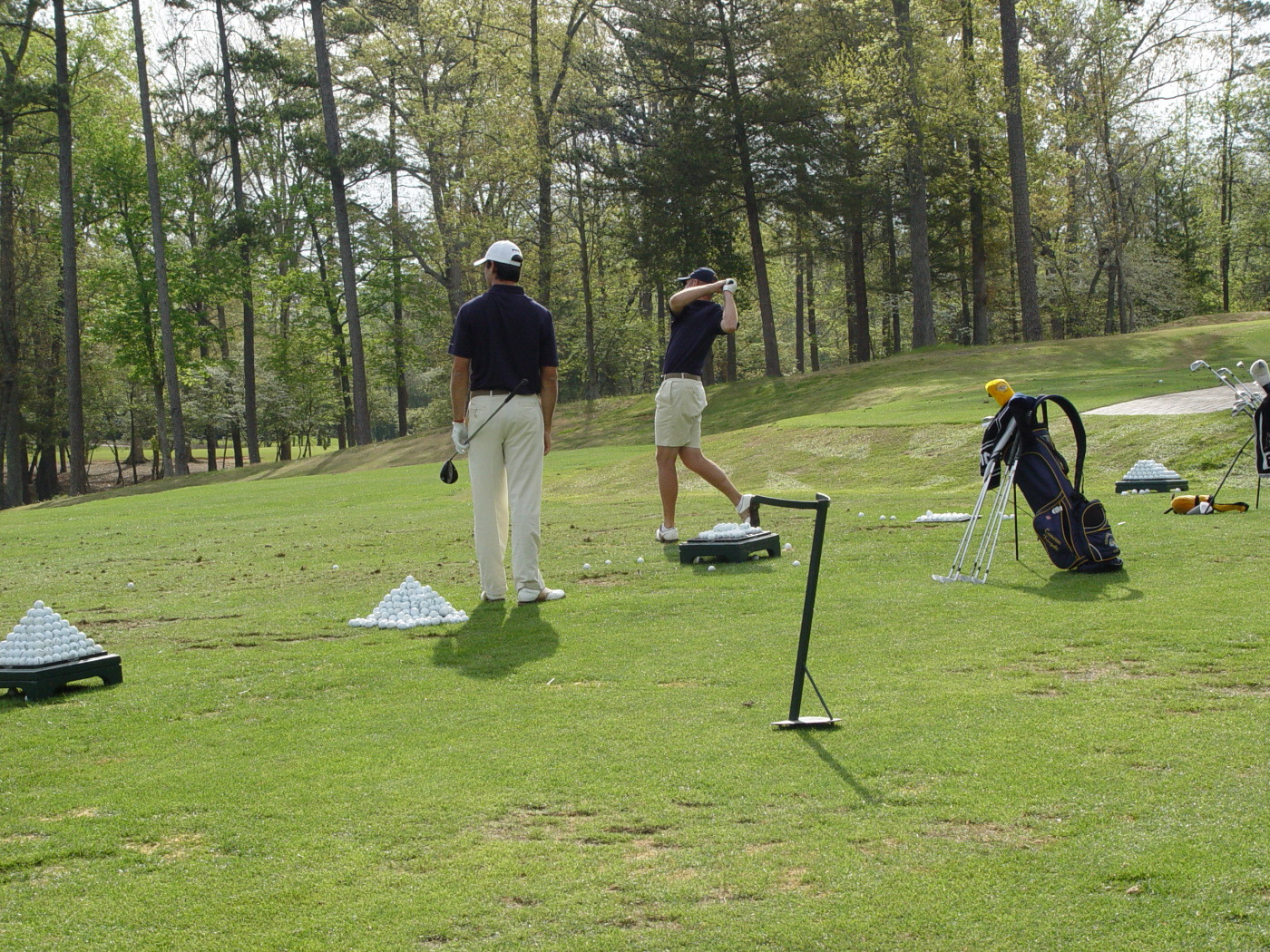 Cameron Tringale (left) and Taylor Hall on the practice range prior to round two of the ACC Golf Championship, April 19, 2008.