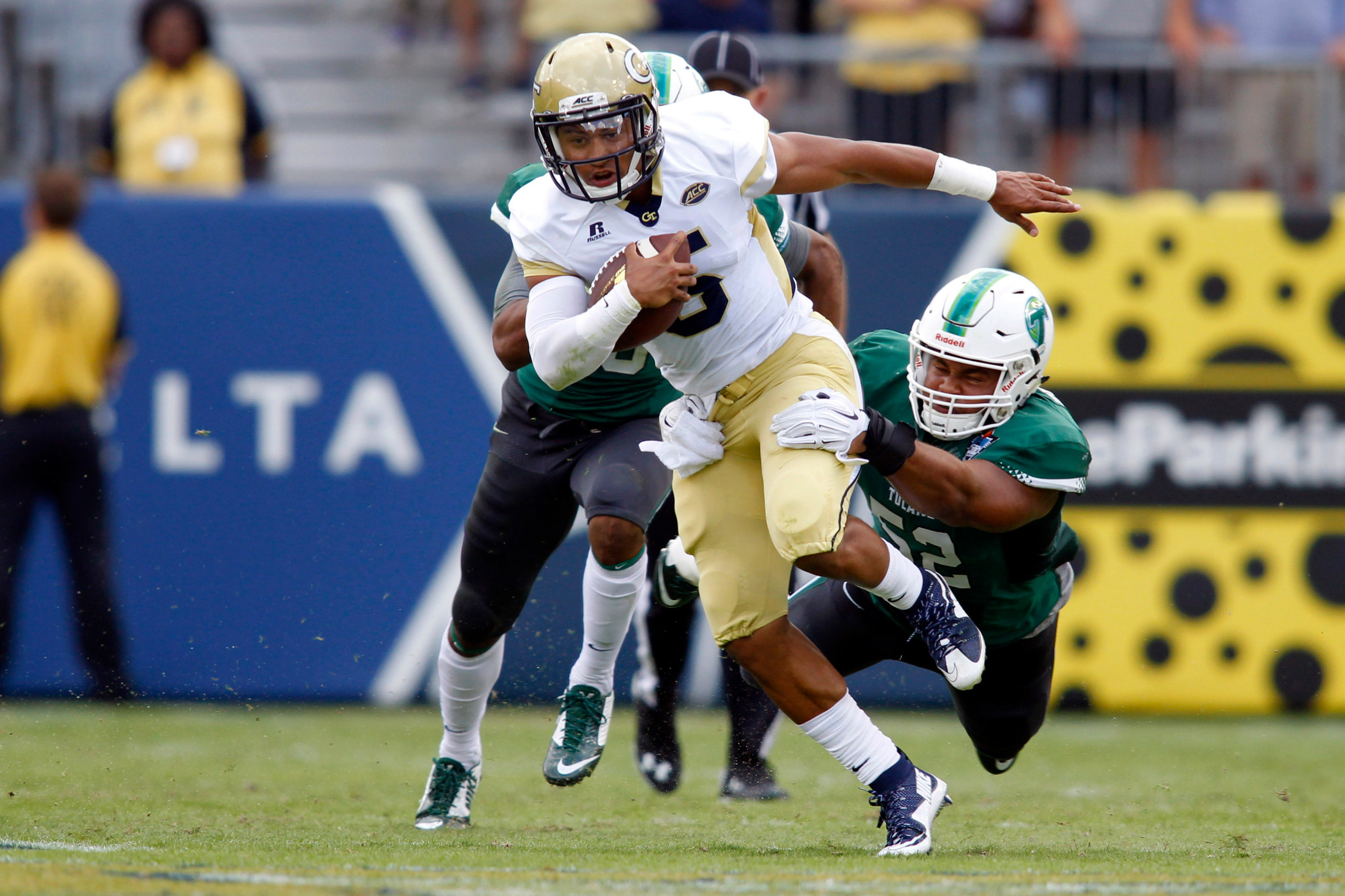 Georgia Tech Yellow Jackets quarterback Justin Thomas (5) runs the ball against the Tulane Green Wave in the first quarter at Bobby Dodd Stadium. Brett Davis-USA TODAY Sports