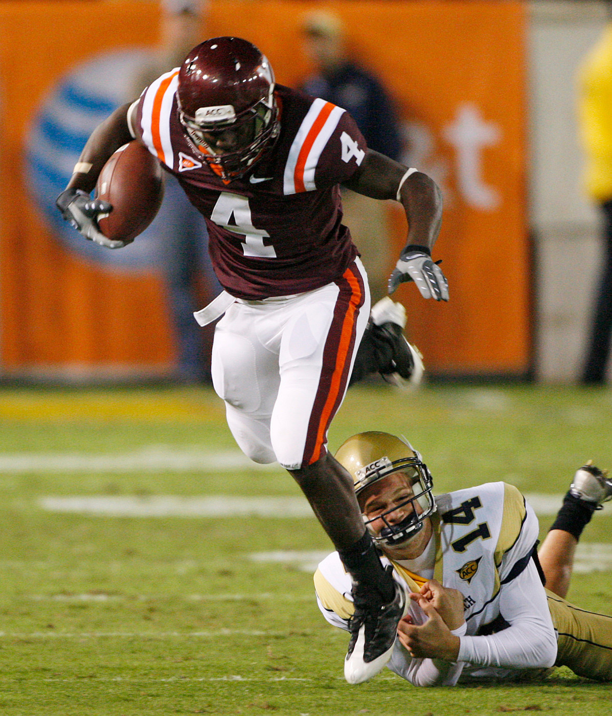 Virginia Tech's David Wilson (4) is stopped by Georgia Tech kicker Scott Blair on a kickoff return in the second quarter of an NCAA college football game in Atlanta, Saturday, Oct. 17, 2009. (AP Photo/John Bazemore)