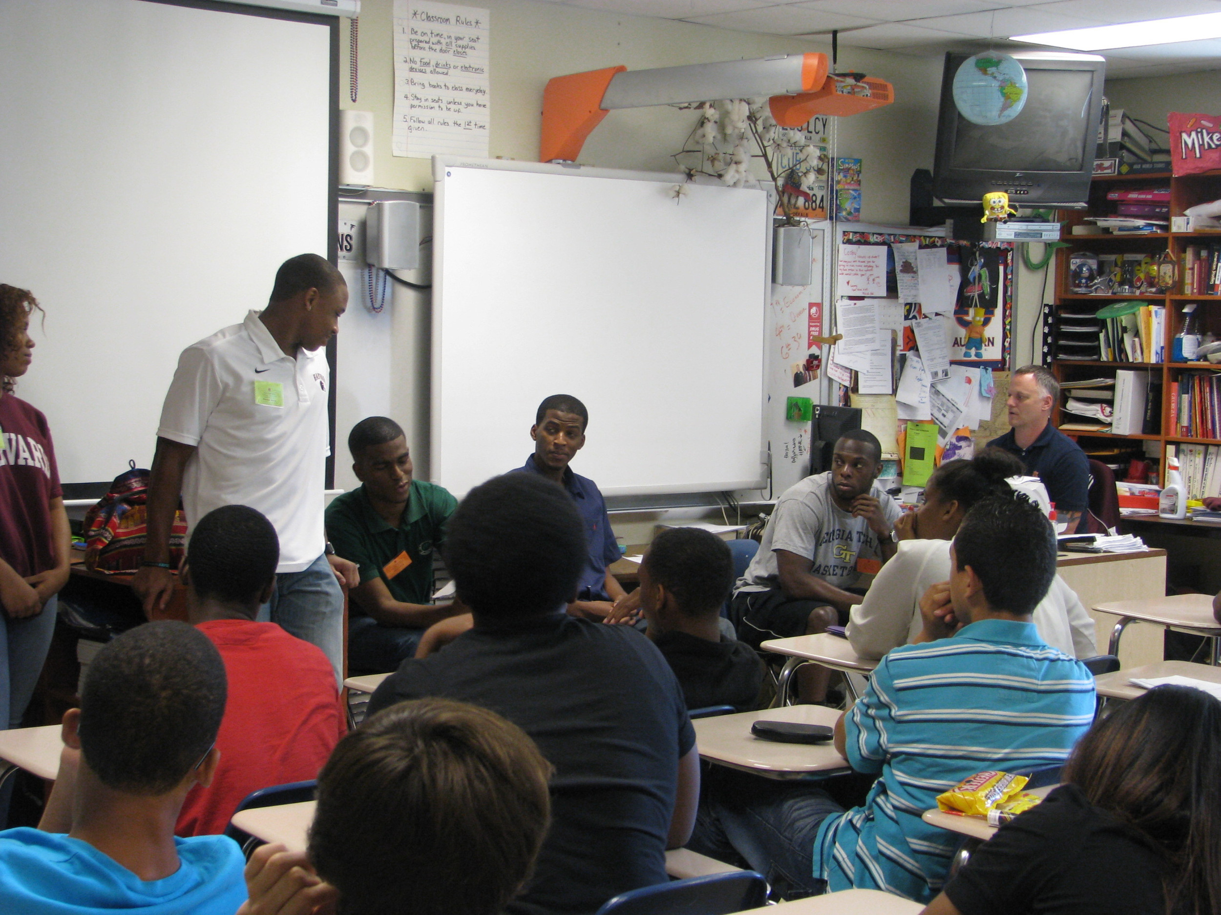 Mfon Udofia joins other college students from the area to speak to Tucker Middle School students about college life and preparing for college.
