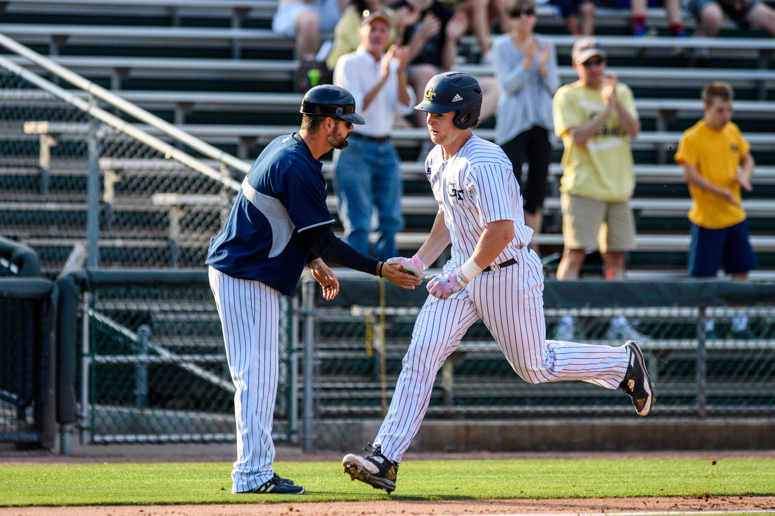 Kyle McCann (15), Assistant Coach Bryan Prince (18)
