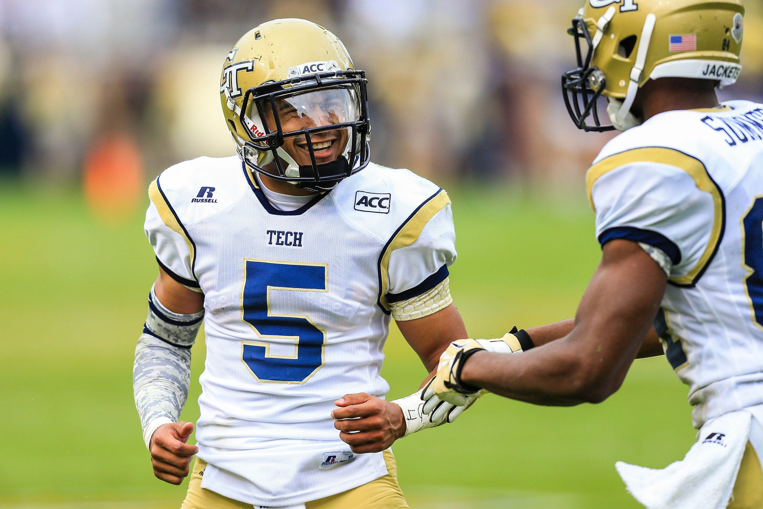 Jay Finch (50) celebrates a touchdown with wide receiver Micheal Summers (84). Mandatory Credit: Daniel Shirey-USA TODAY Sports