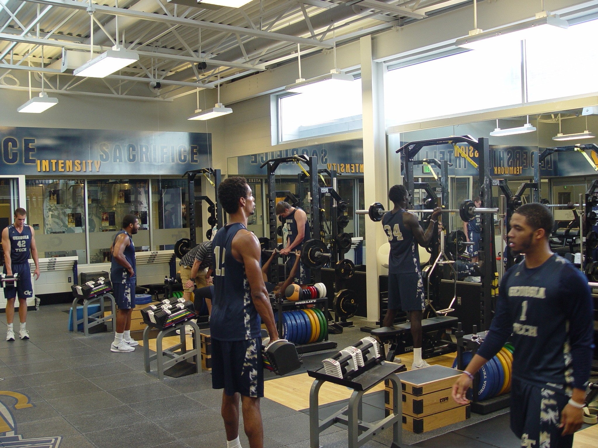 Player development coach Dan Taylor takes the Georgia Tech men's basketball team through a workout on June 16, 2016 in the Zelnak Center weight room.