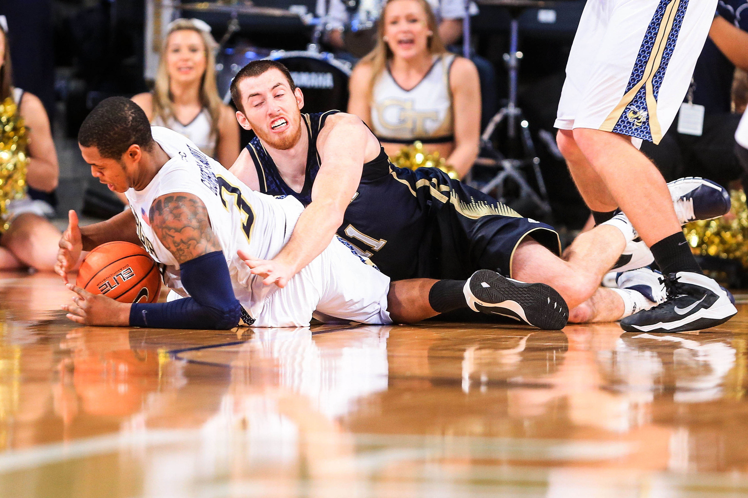 Jan 11, 2014; Atlanta, GA, USA; Notre Dame Fighting Irish center Garrick Sherman (11) and Georgia Tech Yellow Jackets forward Marcus Georges-Hunt (3) battle for a loose ball in the second half at Hank McCamish Pavilion. Georgia Tech won 74-69. Mandatory Credit: Daniel Shirey-USA TODAY Sports