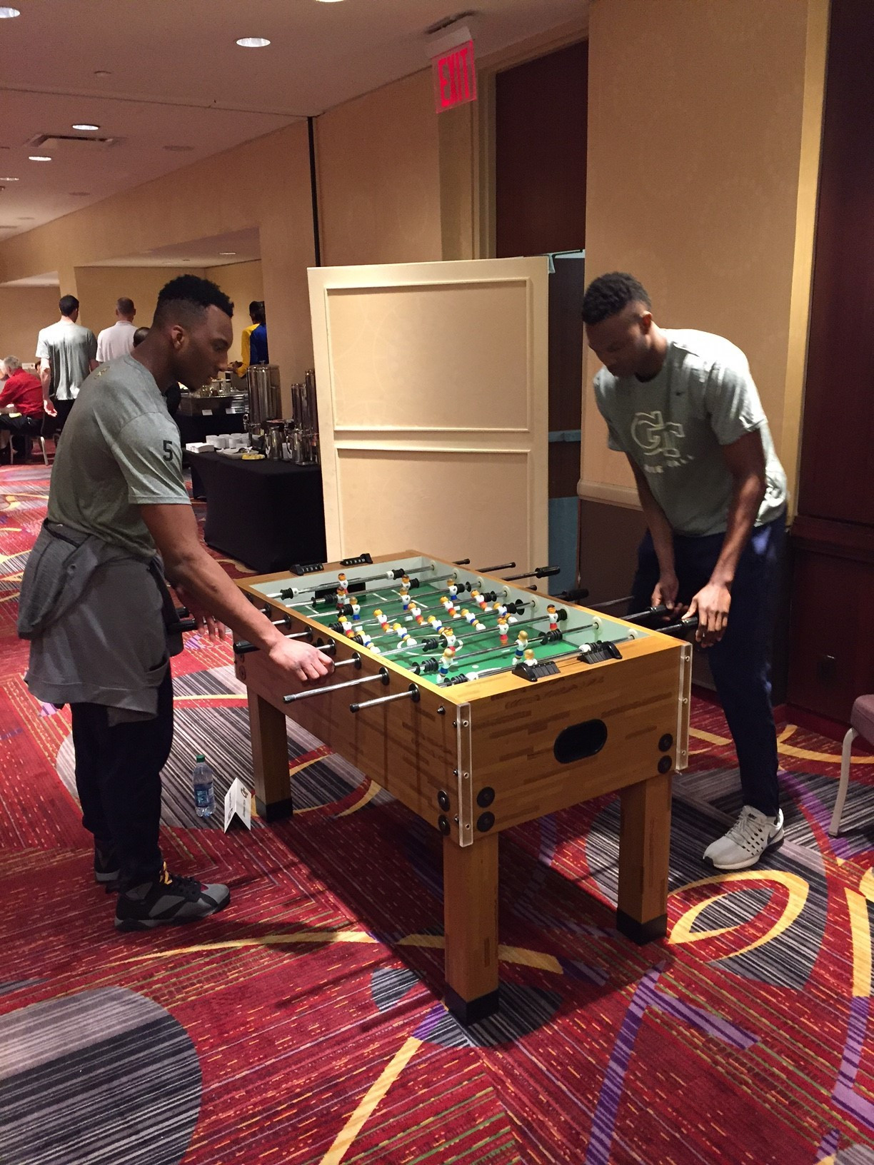 Josh Okogie and Sylveste Ogbonda battle in foosball at the NIT welcome dinner Monday night.