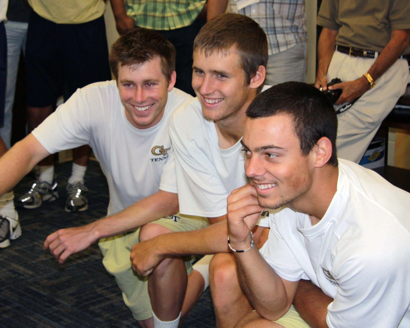 Miguel Muguruza, Kevin King and Ryan Smith cheer Nolan on in his game.