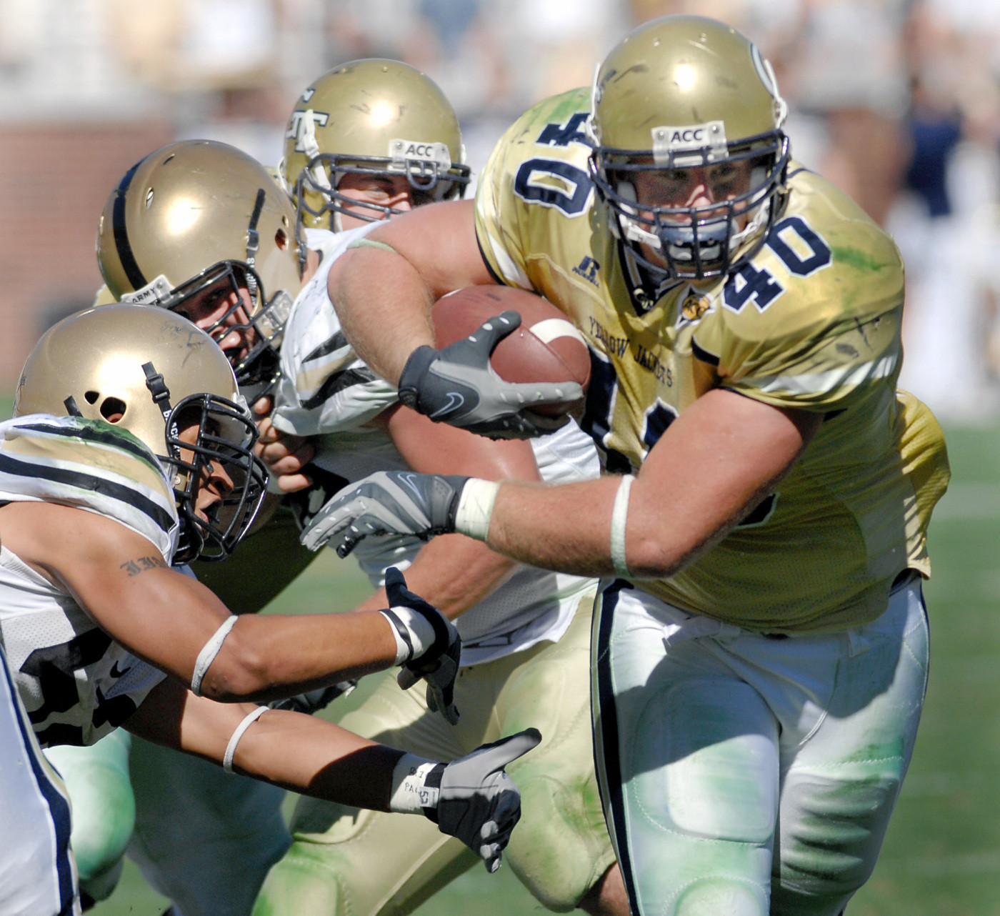 Mike Cox tries to break free from Army defenders on a drive during the third quarter. Tech won 34-10. (AP Photo/Gregory Smith)