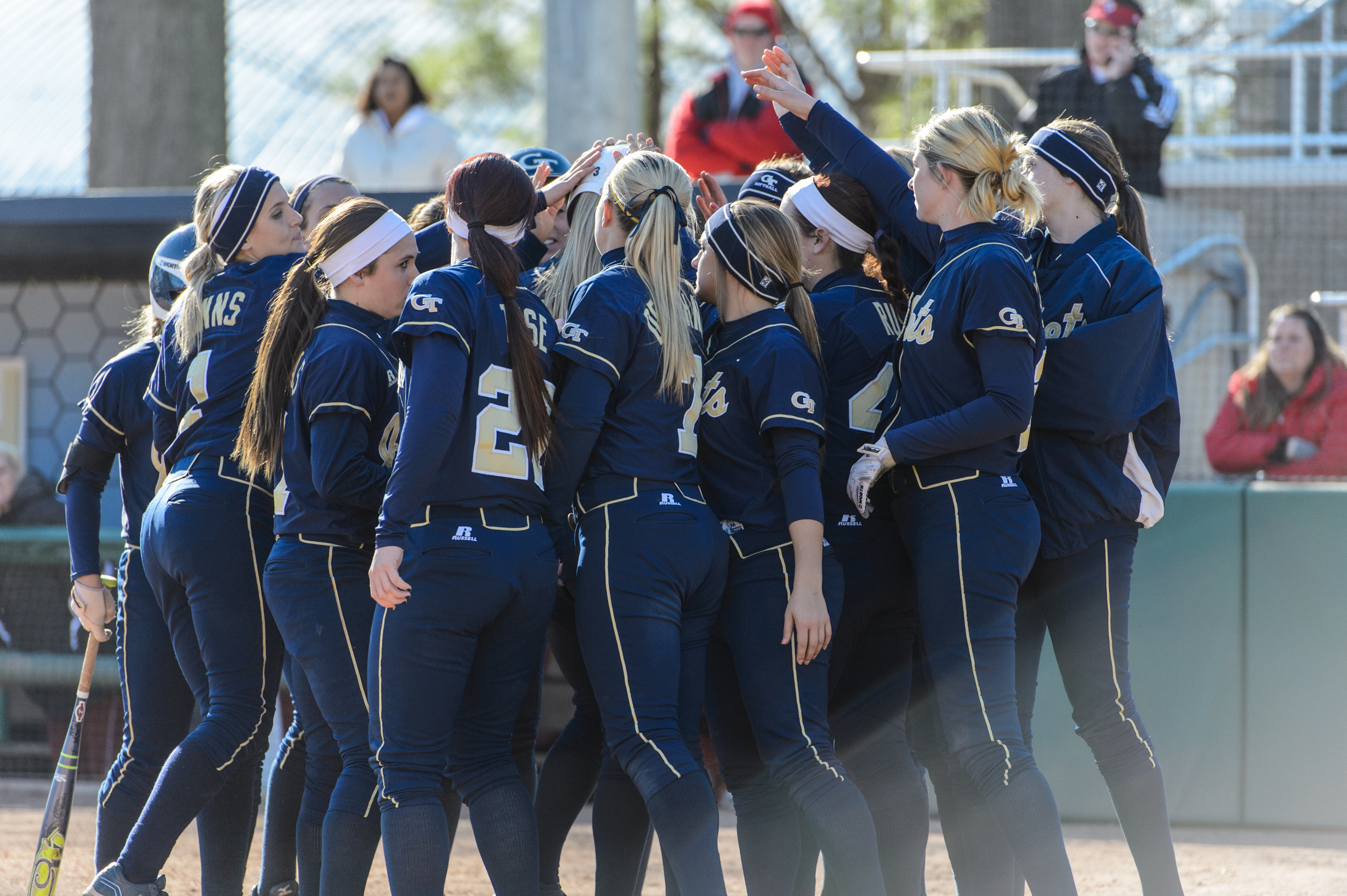 The team celebrates Katie Johnsky's home run.