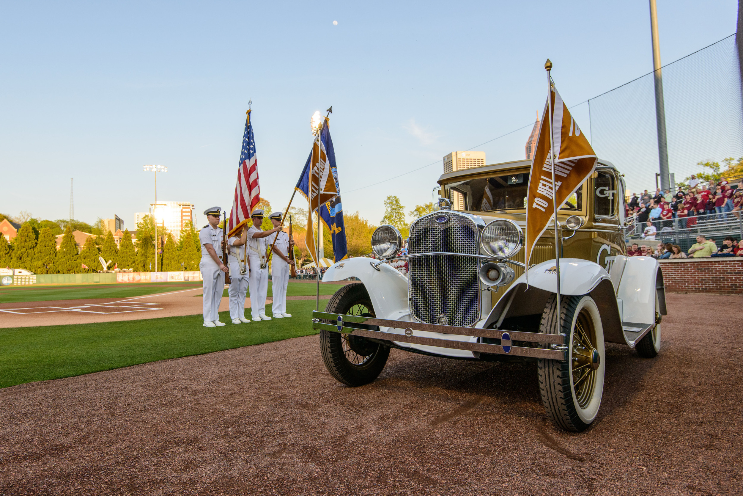 The Ramblin' Reck sits on the field at Russ Chandler Stadium as the Georgia Tech Navy ROTC presents the colors.