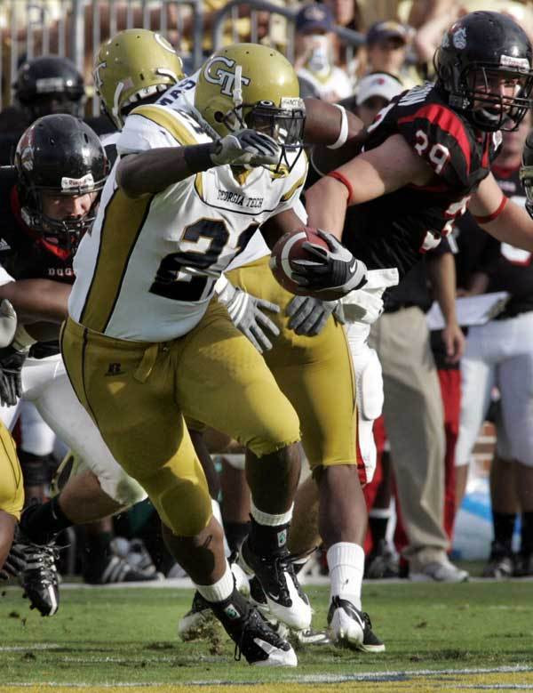 Georgia Tech running back Jonathan Dwyer, front, runs with the ball as Gardner Webb linebacker Marty Patterson (39) looks on.