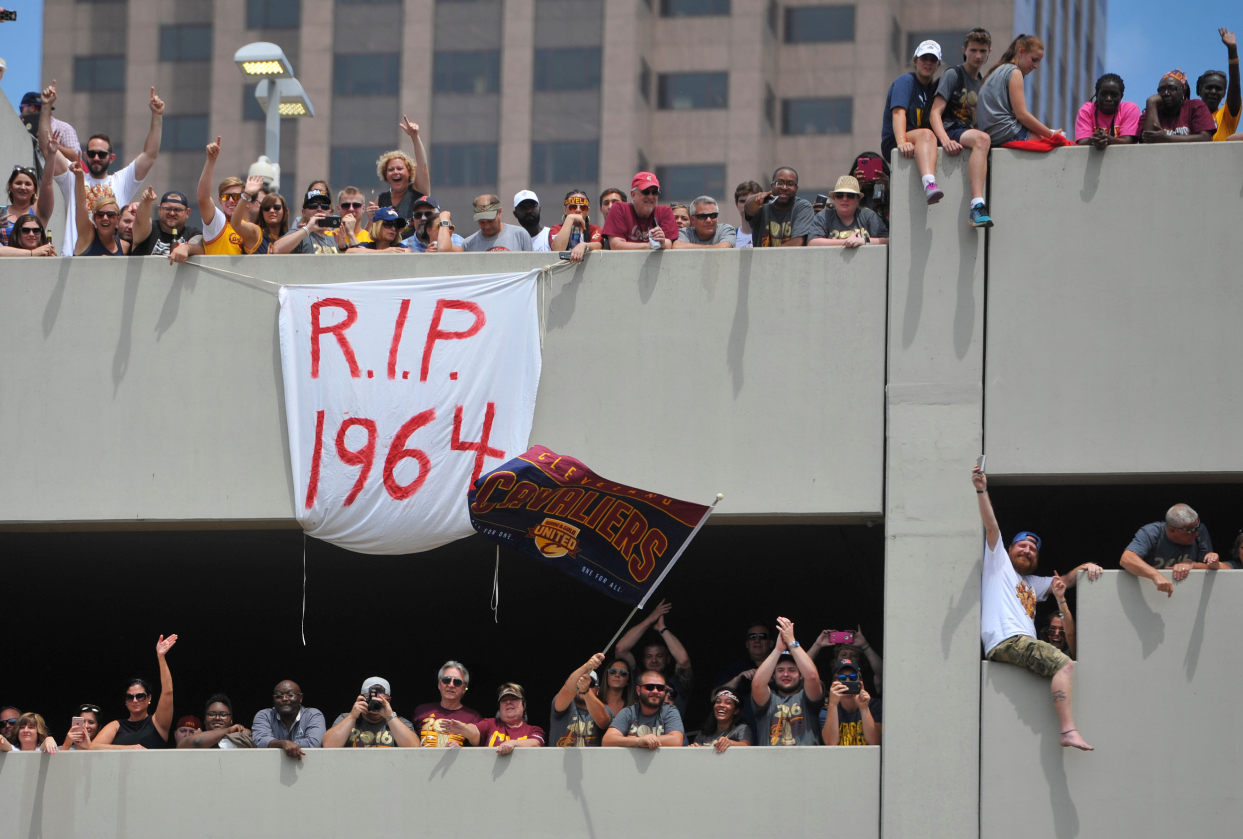 Fans cheer during the Cleveland Cavaliers NBA championship parade in downtown Cleveland. Credit: David Richard-USA TODAY Sports