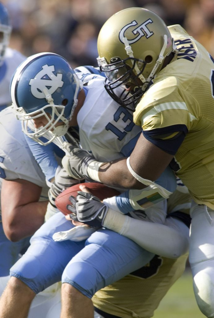 North Carolina quarterback T.J. Yates is sacked by Vance Walker. (AP Photo/John Amis)
