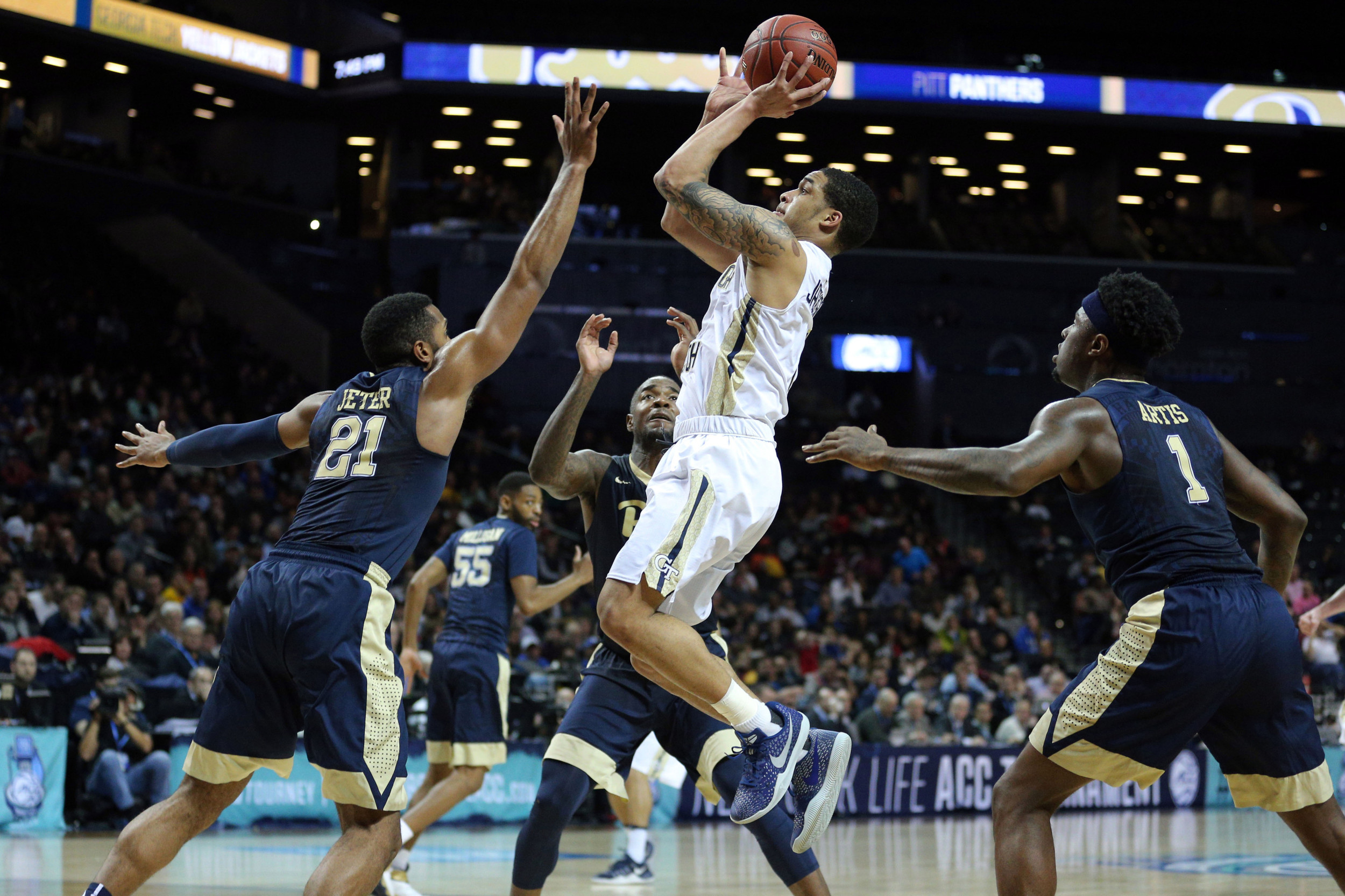 Guard Tadric Jackson shoots against Pittsburgh Panthers forwards Sheldon Jeter, Michael Young and Jamel Artis during the first half of an ACC Conference Tournament game at Barclays Center. Credit: Brad Penner-USA TODAY Sports