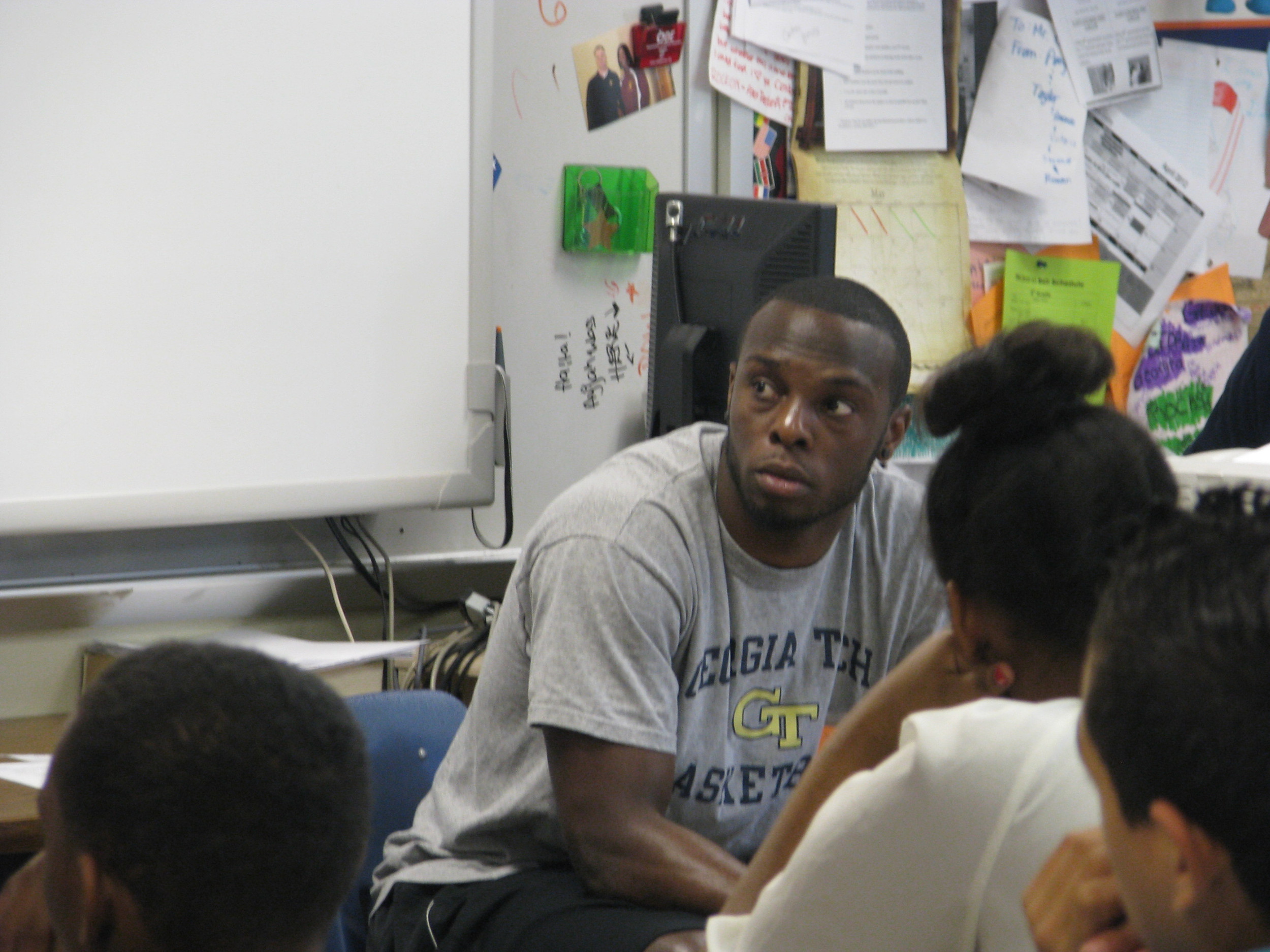 Mfon Udofia joins other college students from the area to speak to Tucker Middle School students about college life and preparing for college.