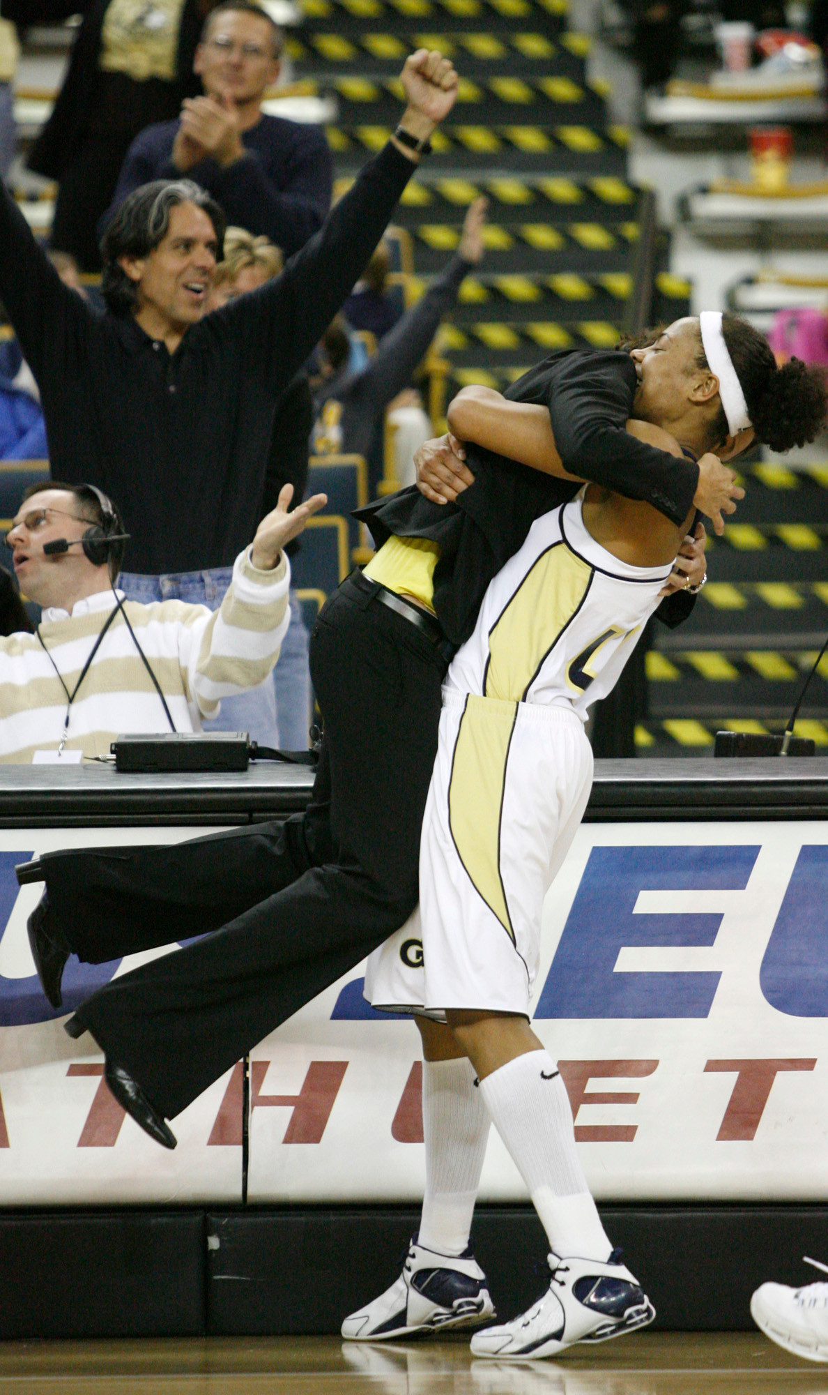 Georgia Tech guard Chioma Nnamaka, right, of Sweden, lifts up head coach MaChelle Joseph in a hug as they celebrate their 77-72 win over Maryland as their women's basketball game ends Thursday, Febuary 1, 2007, in Atlanta. (AP Photo/John Amis)