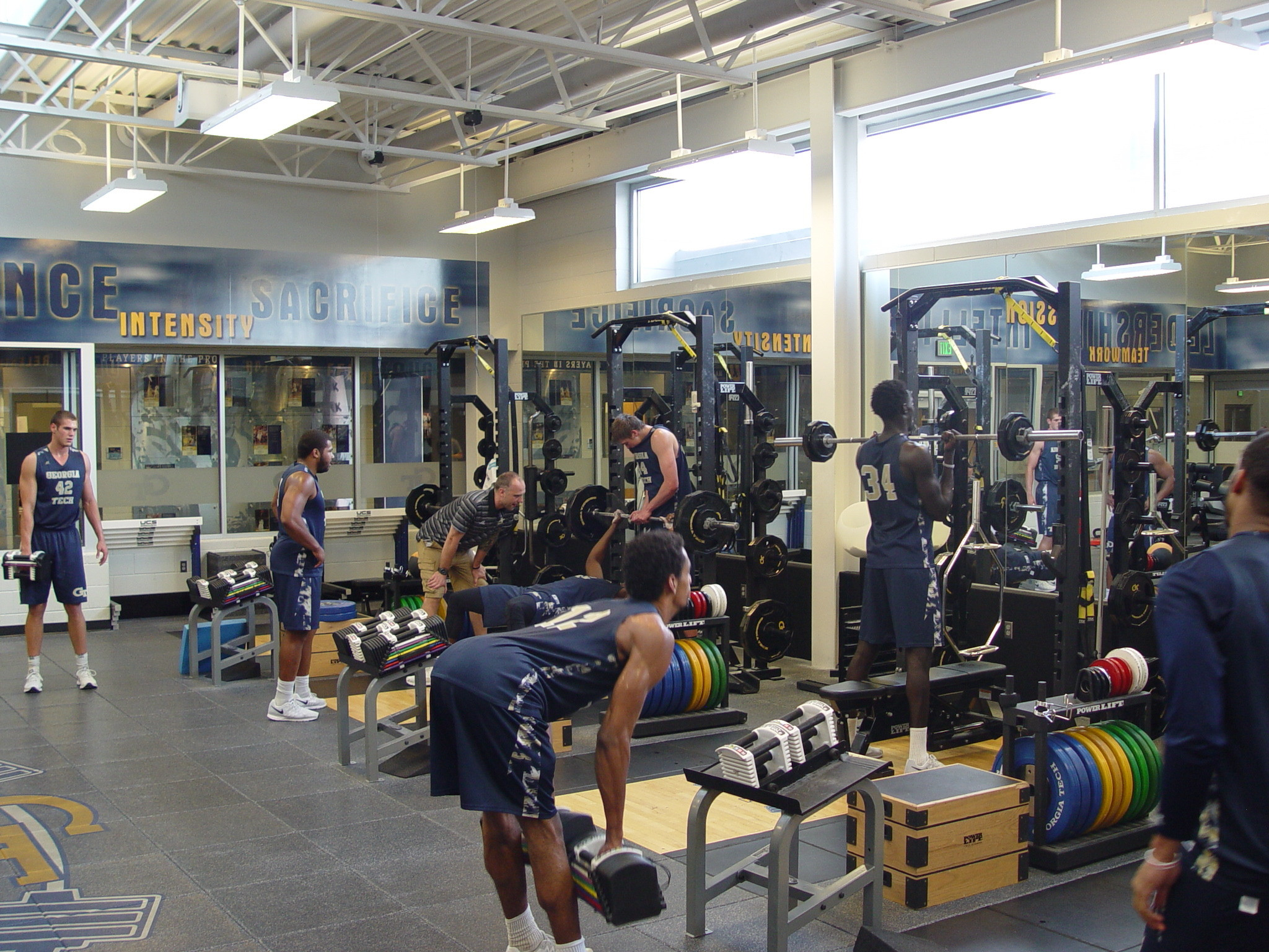 Player development coach Dan Taylor takes the Georgia Tech men's basketball team through a workout on June 16, 2016 in the Zelnak Center weight room.