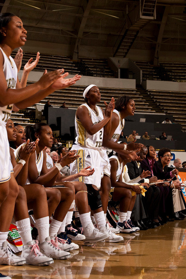 Mo Bennett and the bench cheers on the team