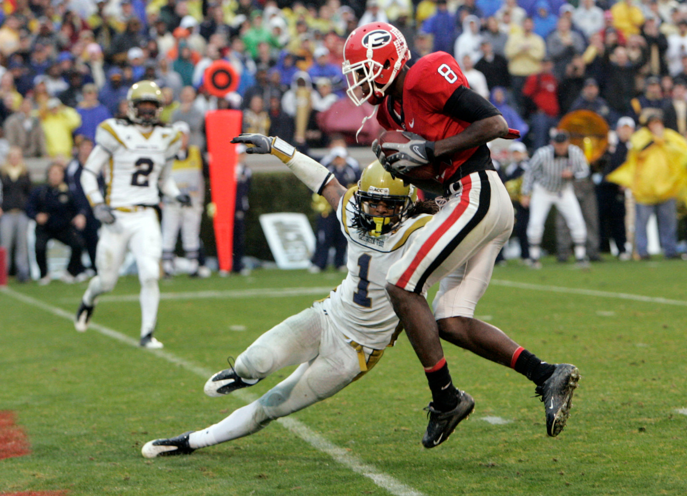 Georgia's A.J. green (8) scores as Morgan Burnett defends in the fourth quarter of in Athens, Ga., , Saturday, Nov. 29, 2008. Tech won 45-42. (AP Photo/John Bazemore)