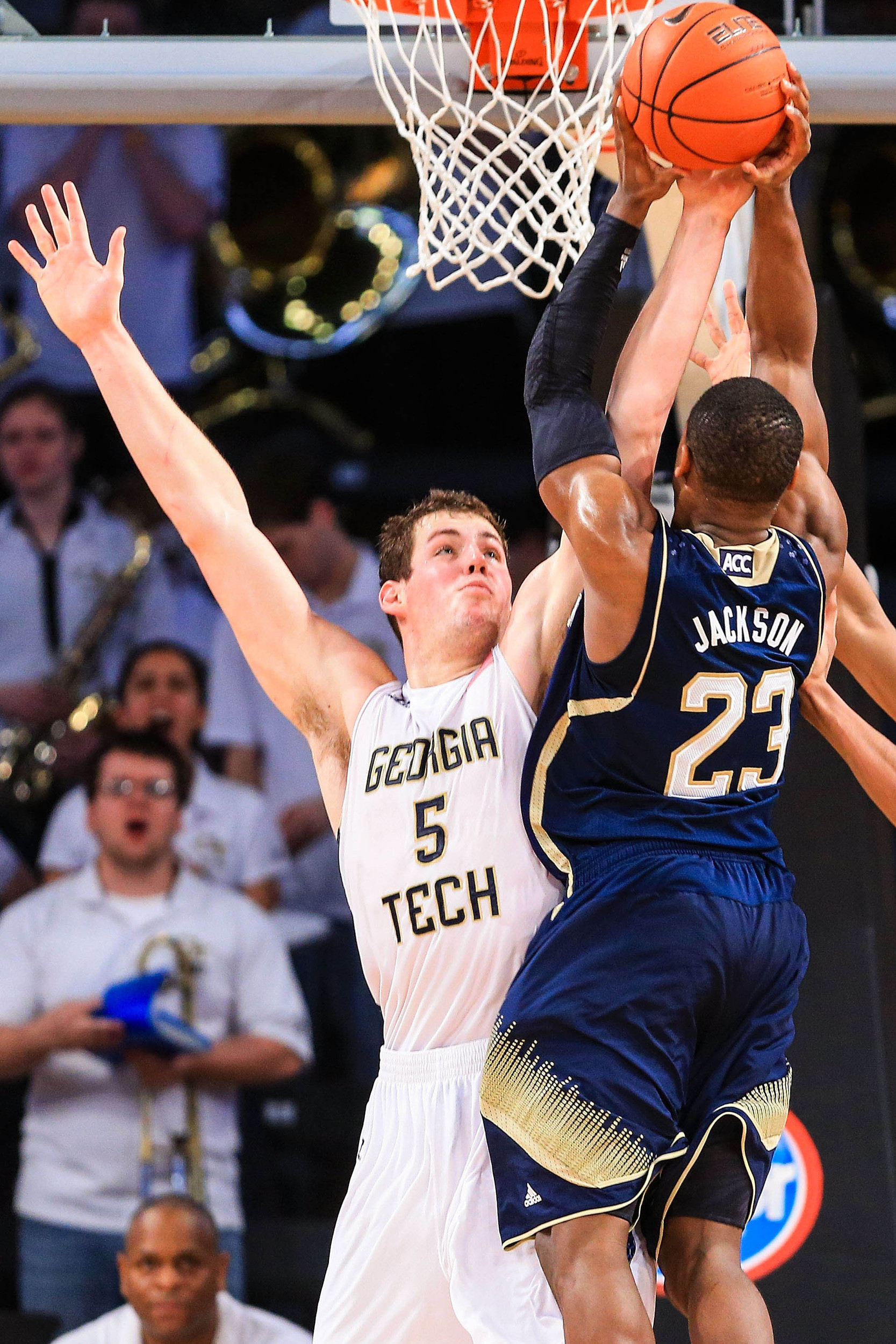Jan 11, 2014; Atlanta, GA, USA; Georgia Tech Yellow Jackets center Daniel Miller (5) blocks a shot by Notre Dame Fighting Irish guard Demetrius Jackson (23) in the second half at Hank McCamish Pavilion. Georgia Tech won 74-69. Mandatory Credit: Daniel Shirey-USA TODAY Sports
