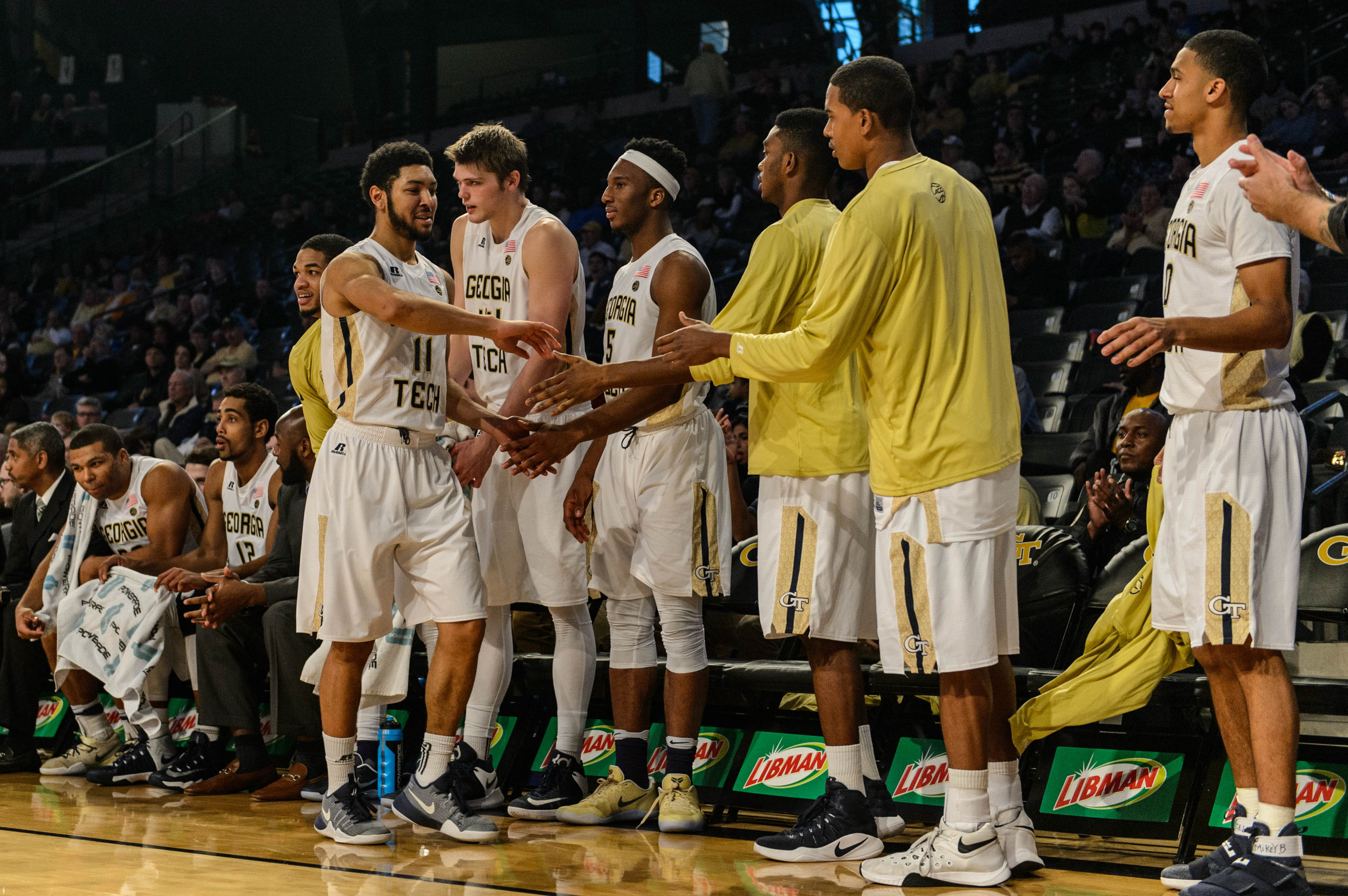 Teammates congratulate Josh Heath (11)