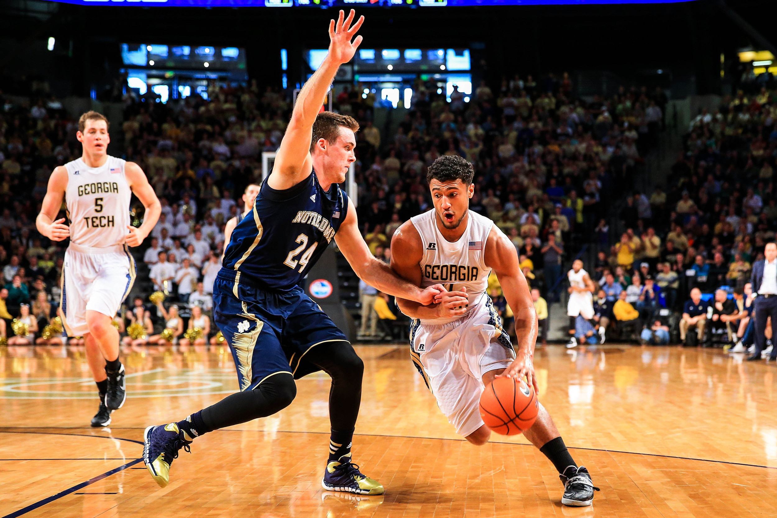 Jan 11, 2014; Atlanta, GA, USA; Georgia Tech Yellow Jackets guard Chris Bolden (11) moves to the basket past Notre Dame Fighting Irish guard/forward Pat Connaughton (24) in the second half at Hank McCamish Pavilion. Georgia Tech won 74-69. Mandatory Credit: Daniel Shirey-USA TODAY Sports