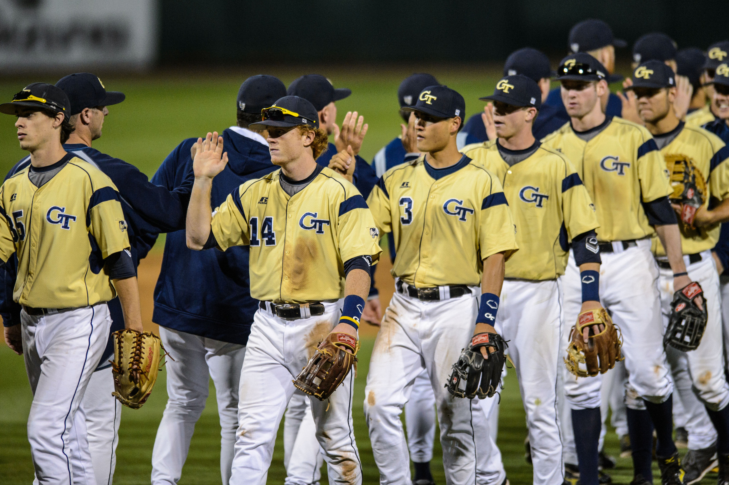 The team exchanges high fives after the win.