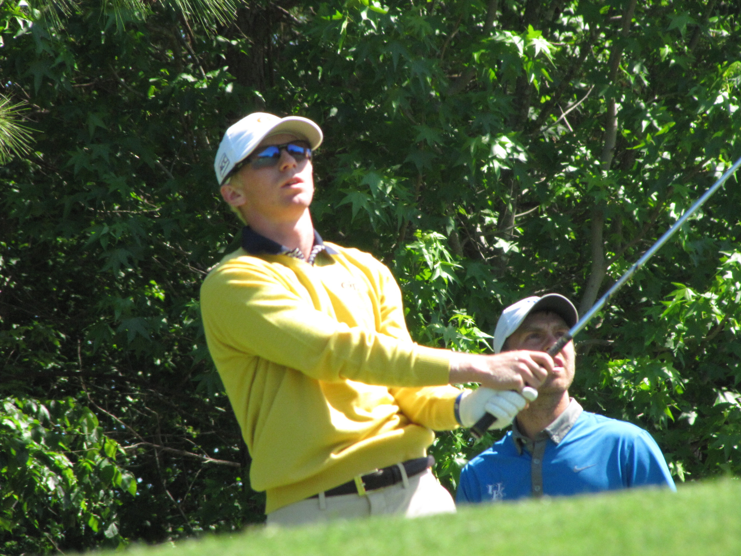 Anders Albertson watches his tee ball at the par-3 6th hole during the final round of the NCAA Raleigh Regional.
